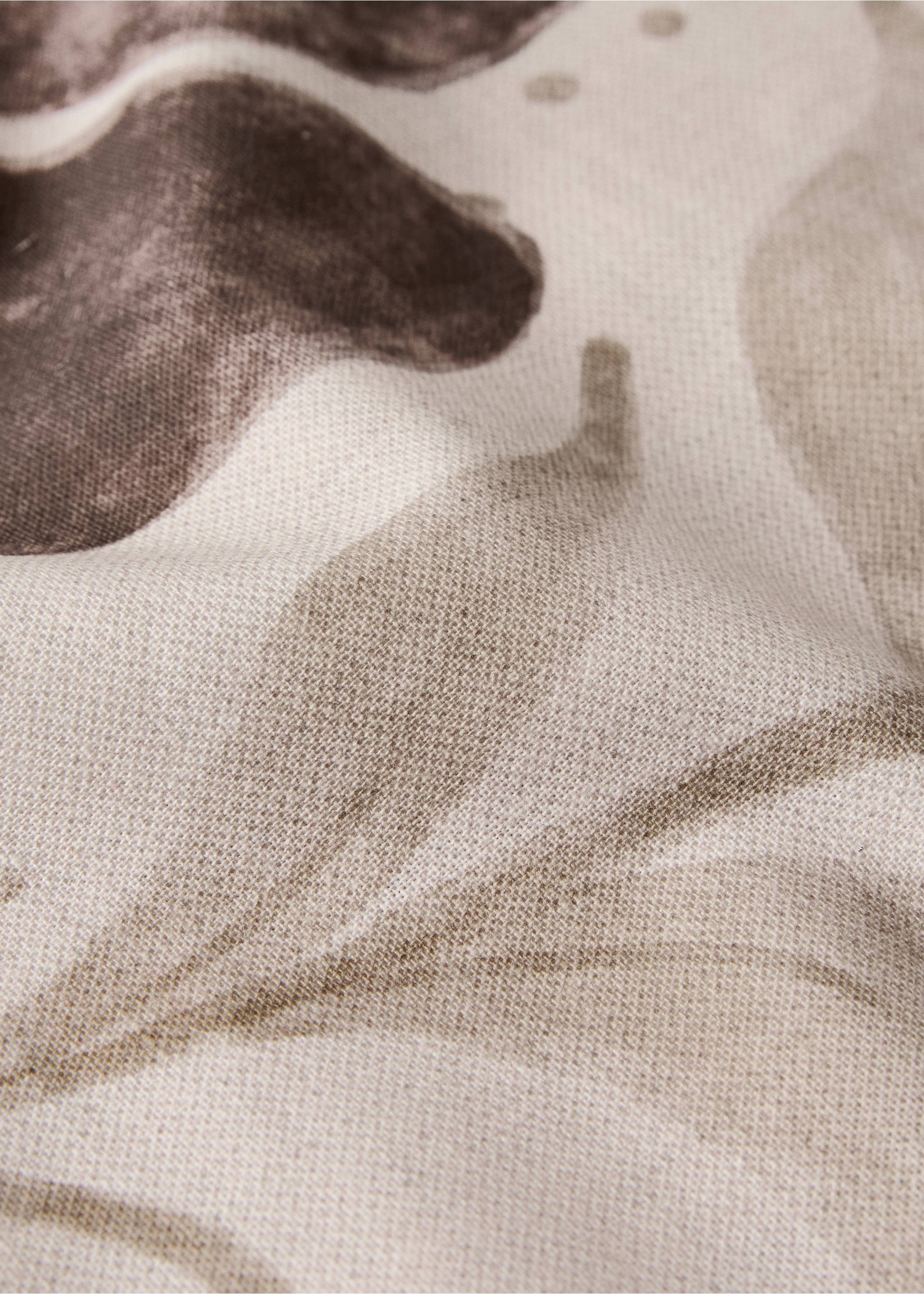 Tablecloth detail showing a brown and beige botanical print., Medium Brown. Ref: 17034134-00.