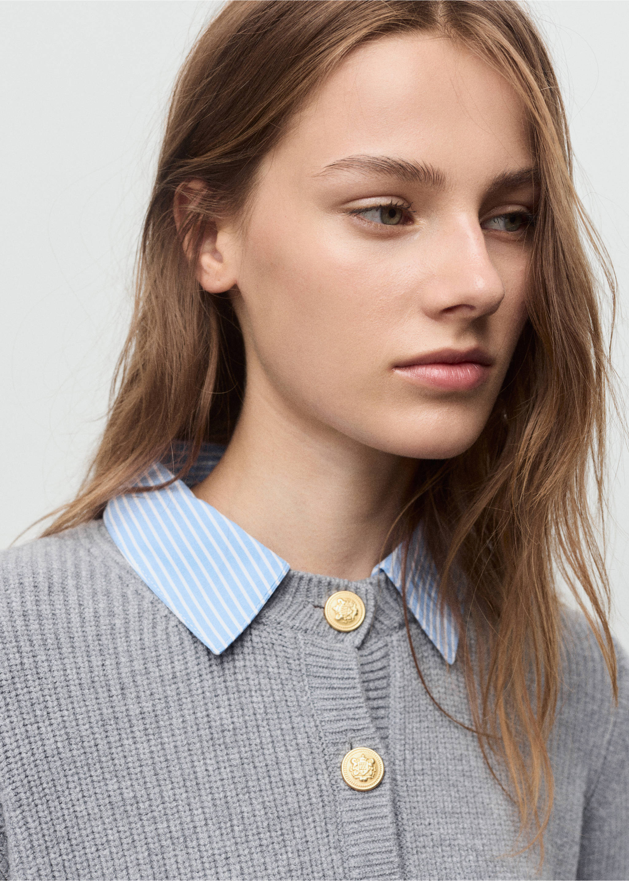 Grey knit cardigan with gold buttons, layered over a blue striped shirt., Grey. Ref: 17035796-00.