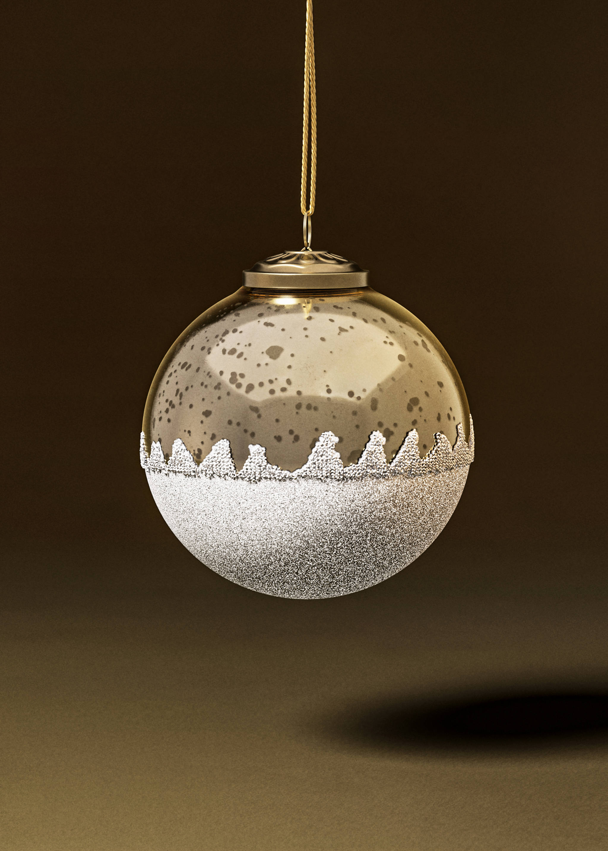 Gold glass Christmas bauble with speckled finish and textured silver glitter base.