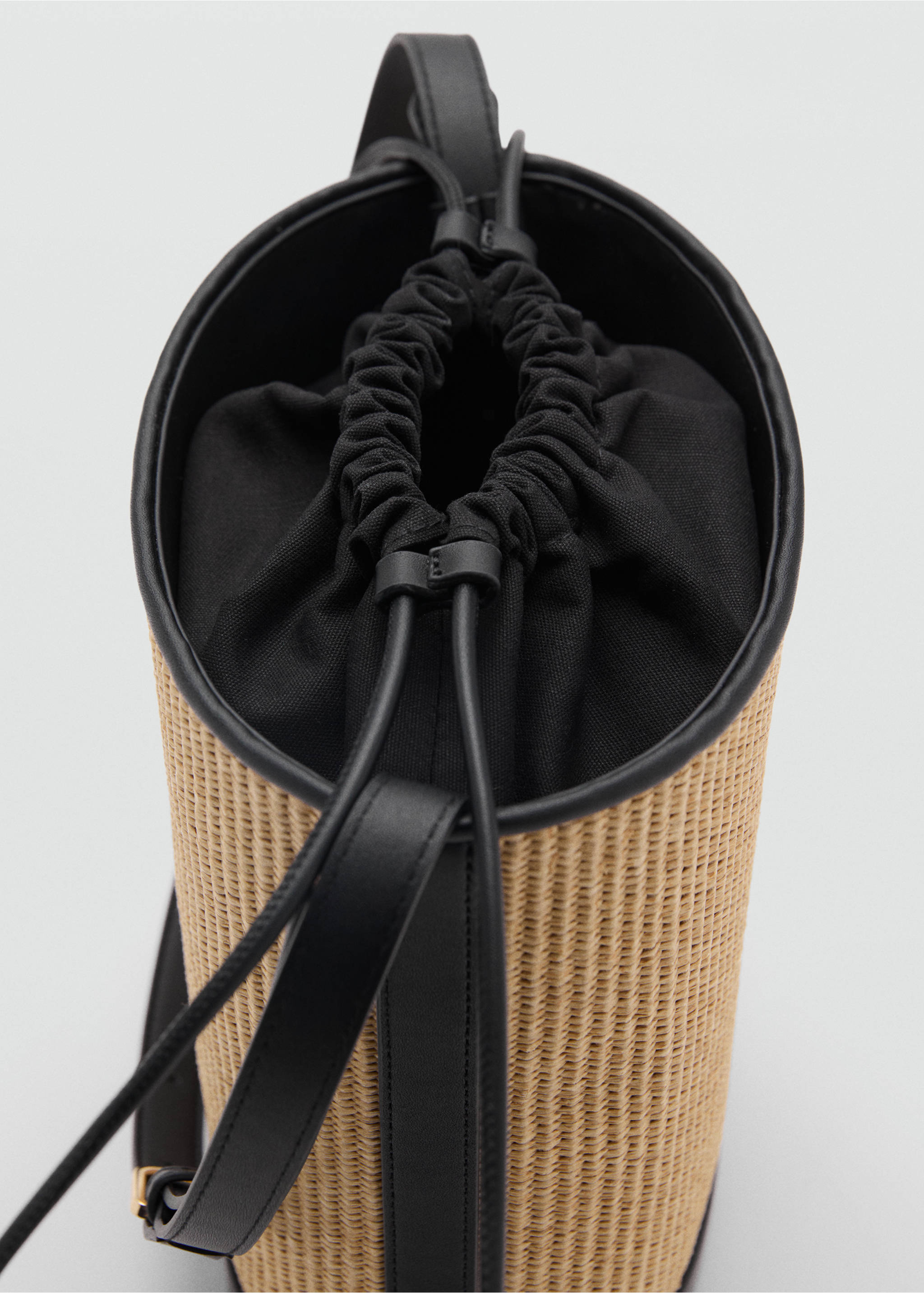 Medium raffia-effect bucket bag - Details of the article 1, Black. Ref: 17041128-00.