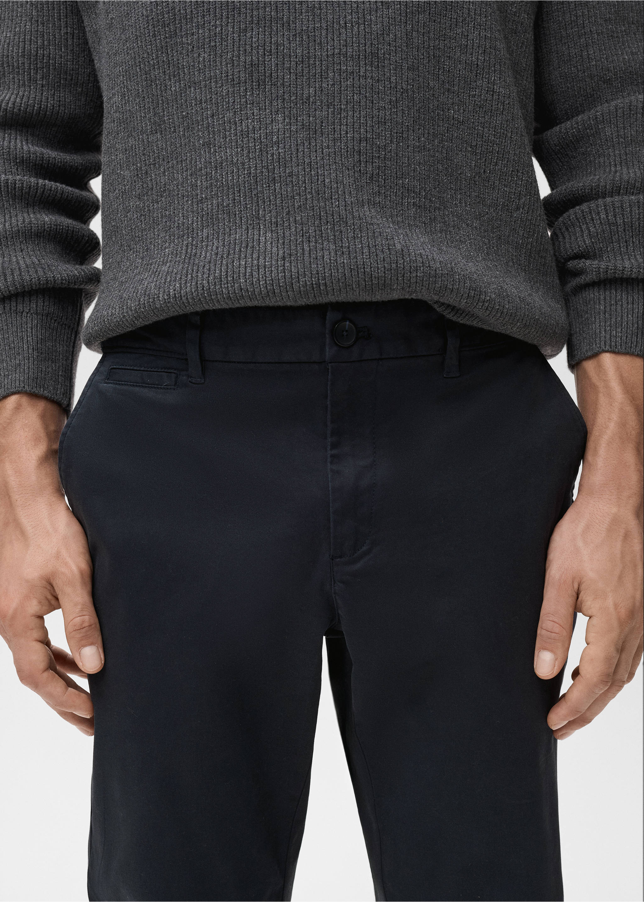Close-up of dark navy blue trousers worn with a dark grey knit sweater, Dark Navy. Ref: 17041144-00.