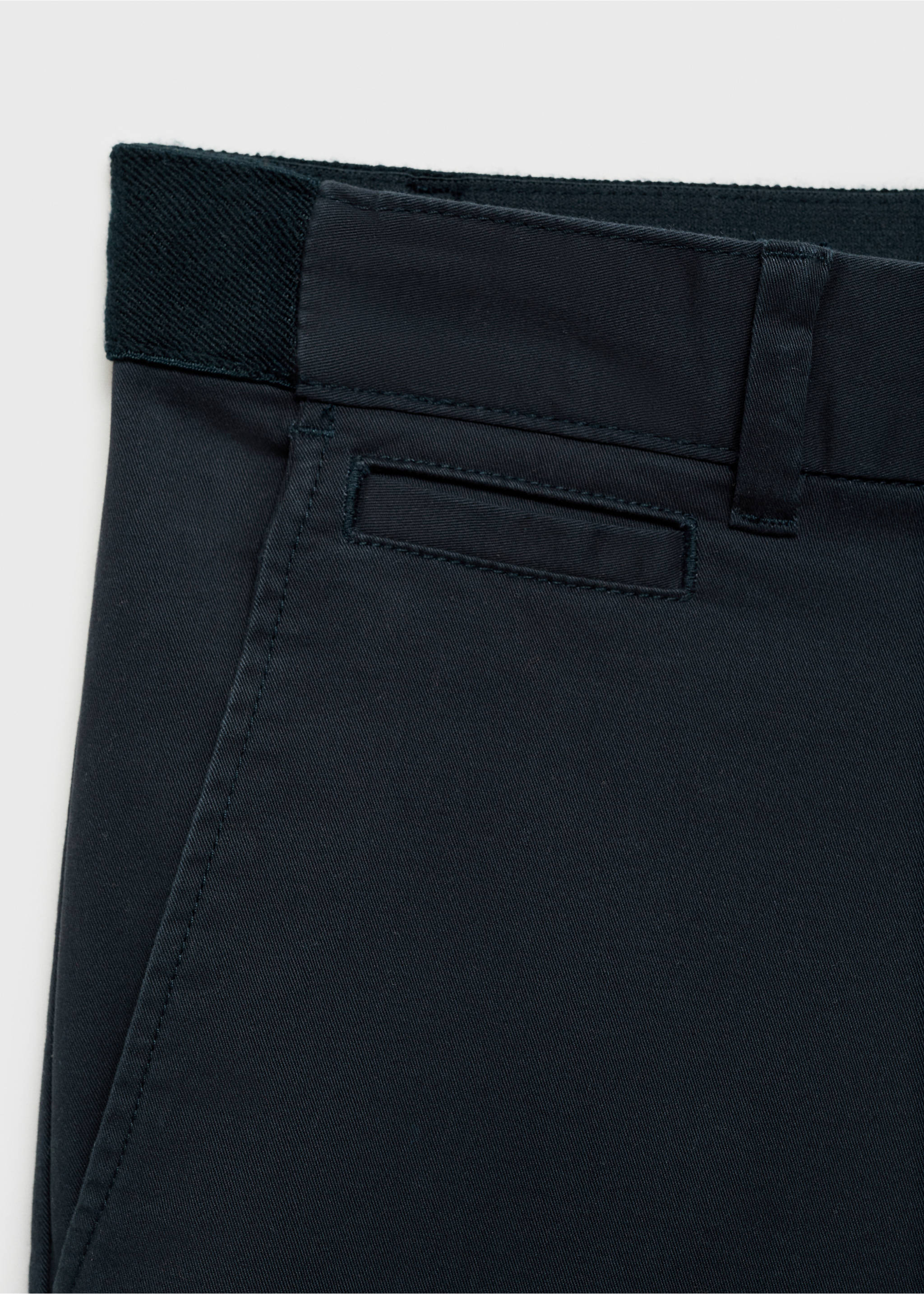 Close-up of navy blue trousers showing the waistband and fabric detail., Dark Navy. Ref: 17041144-00.