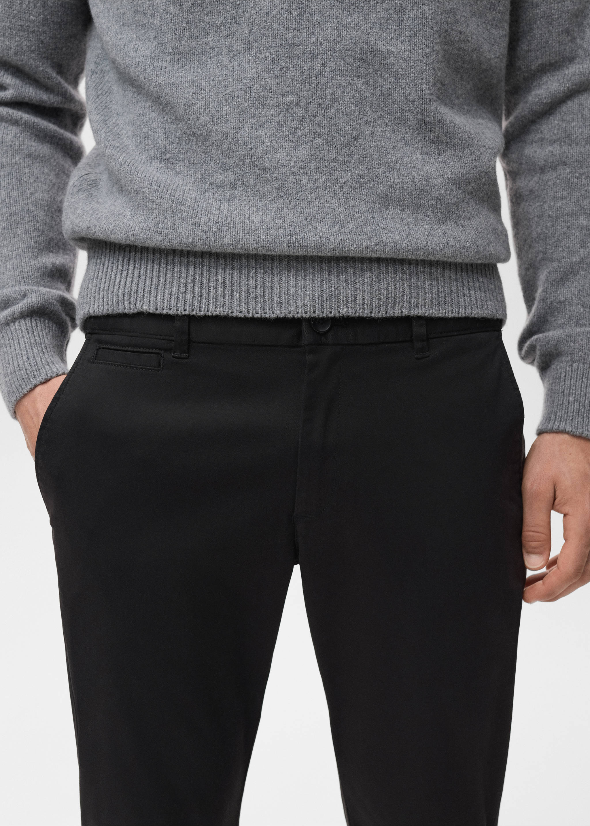 Black trousers with belt loops and pocket detail, worn with a grey sweater., Black. Ref: 17041144-00.