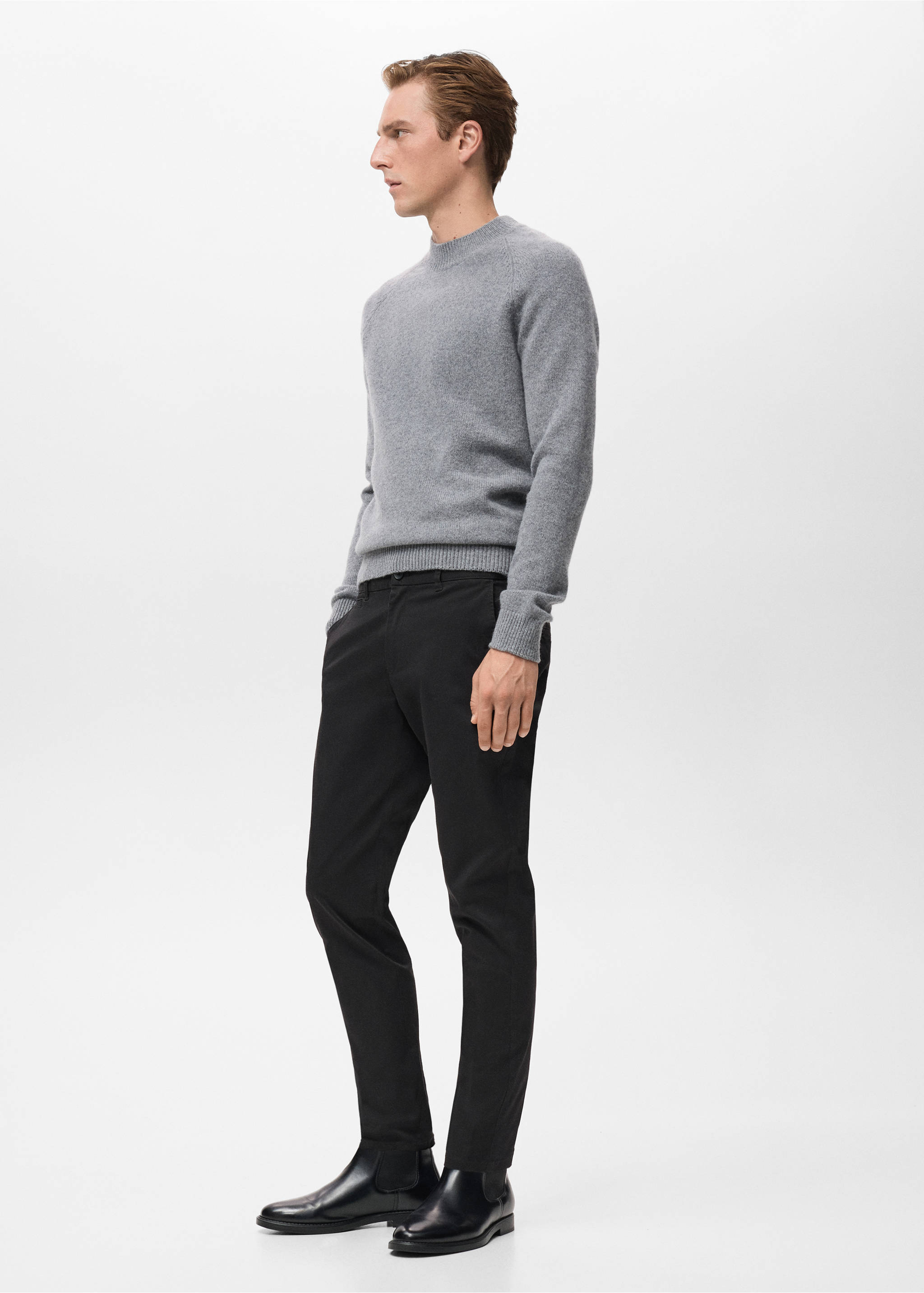 Slim black trousers worn with a grey knitted sweater and black boots., Black. Ref: 17041144-00.