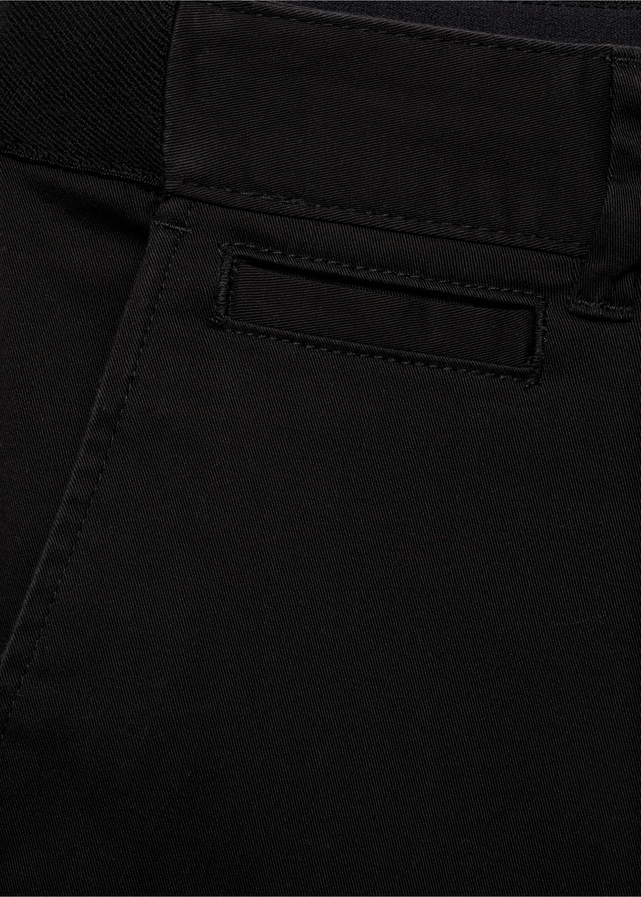 Close-up fabric detail of black trousers focusing on the waistband and pocket., Black. Ref: 17041144-00.