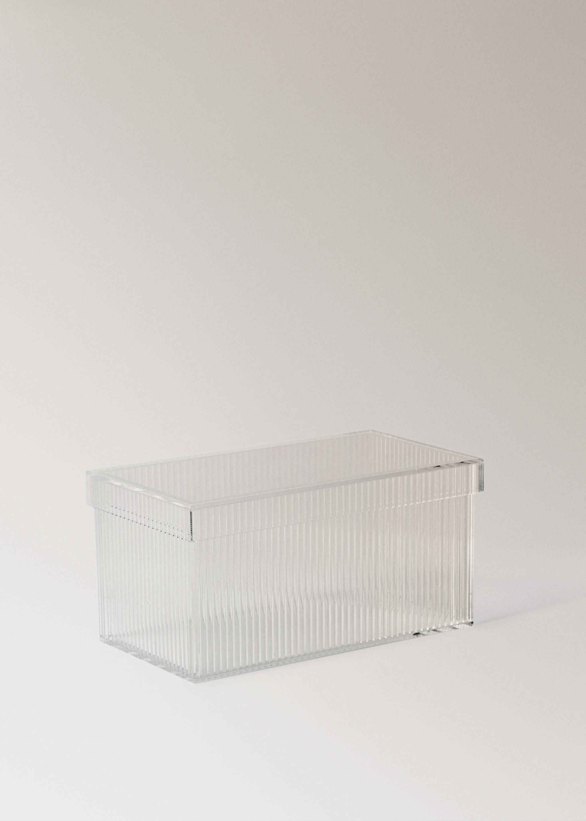 Transparent rectangular storage box with a ribbed texture and matching lid.