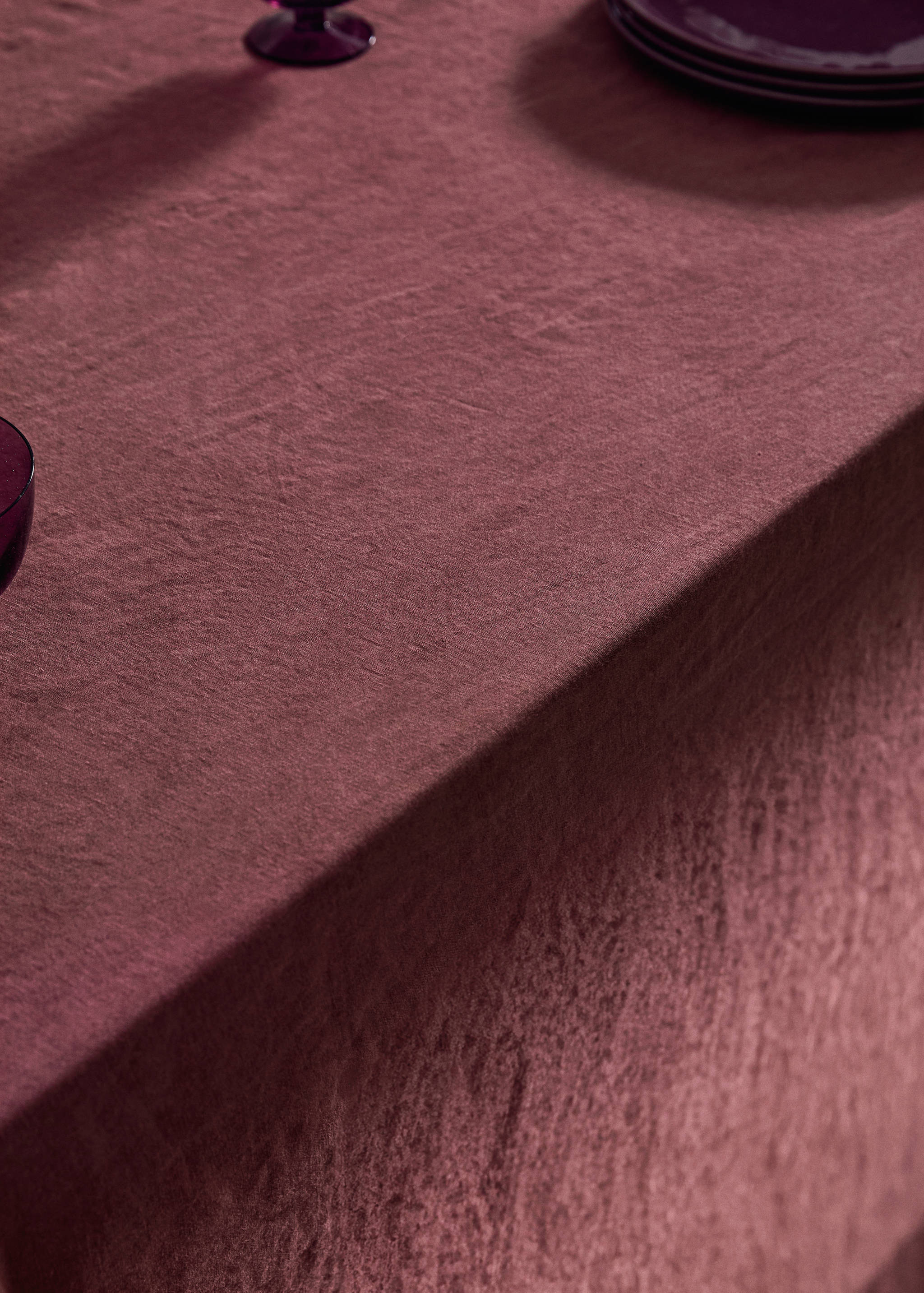 Burgundy tablecloth featuring a textured finish