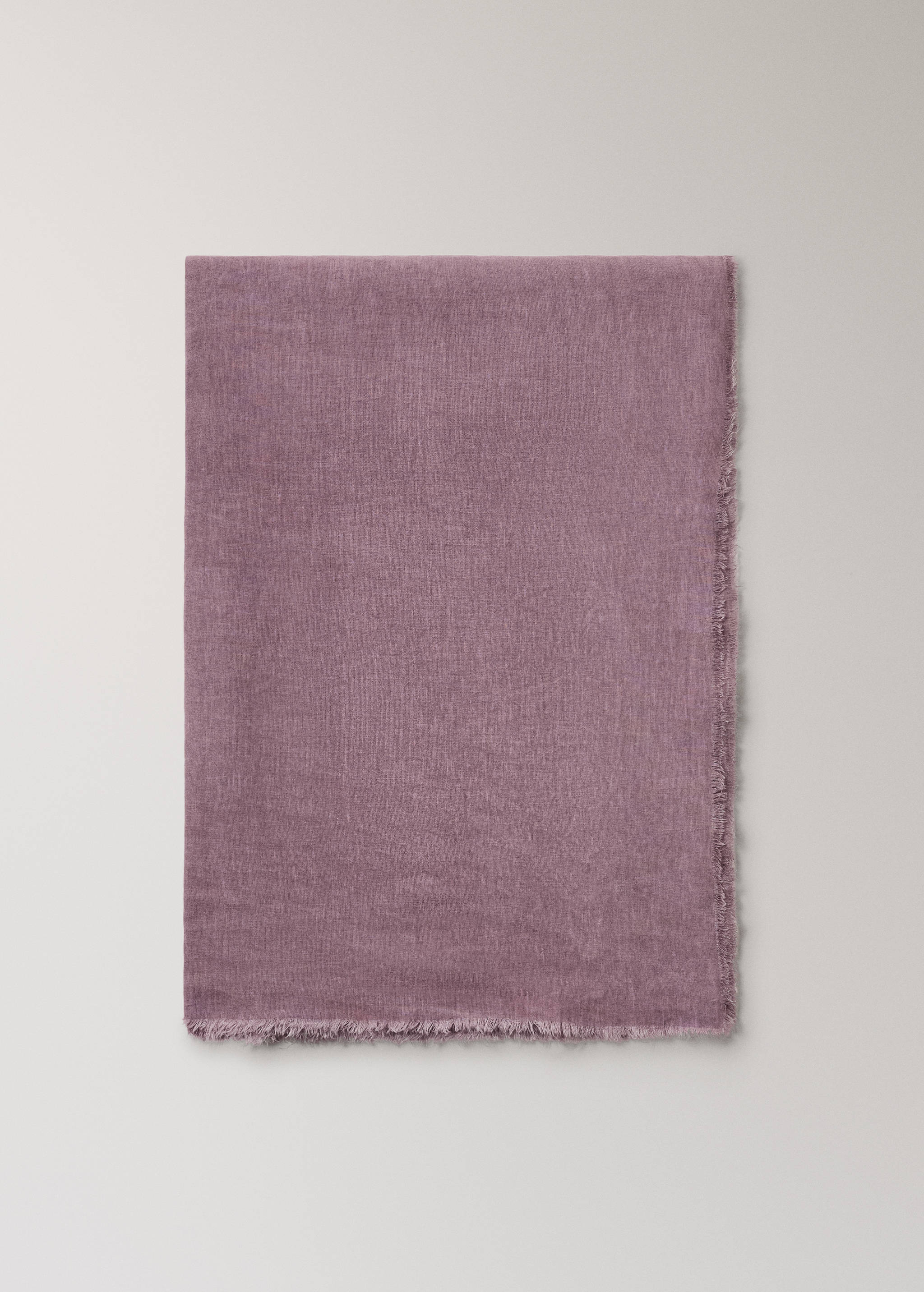 Mauve textured linen tablecloth with frayed edges.