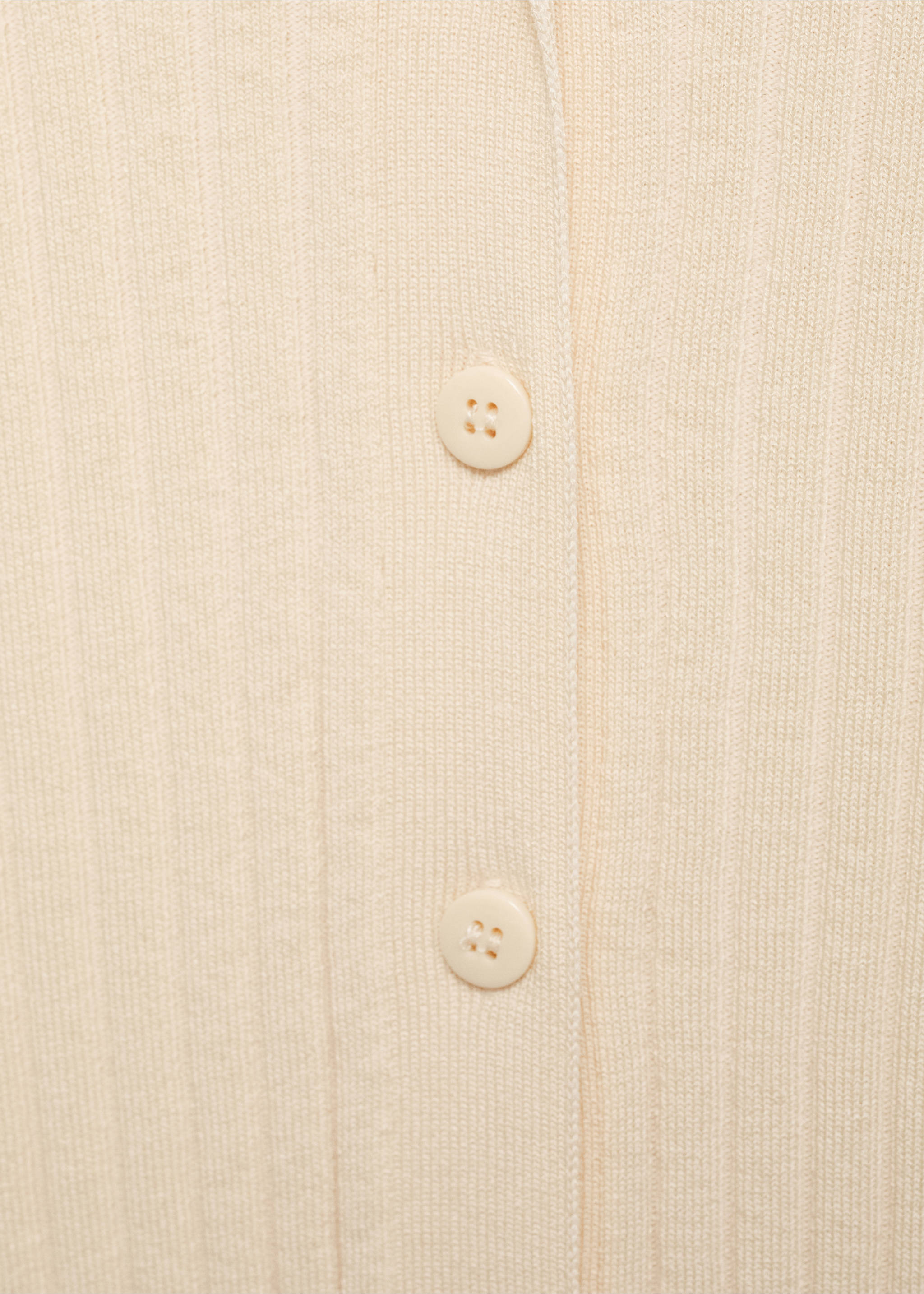 Close-up of a cream ribbed knit cardigan showing buttons., Ecru. Ref: 17044103-00.