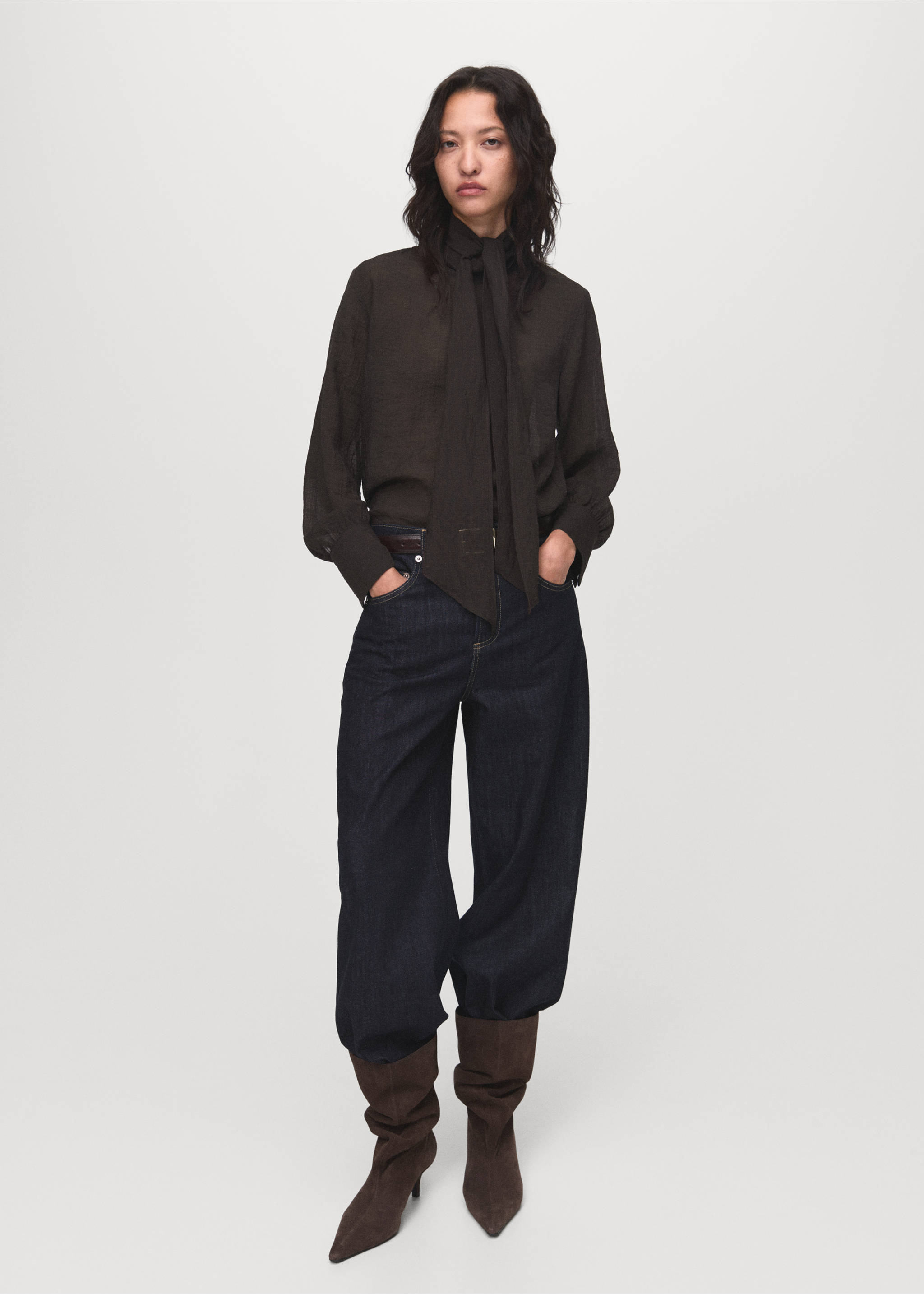 Dark brown long-sleeved blouse with a neck tie, styled with dark denim trousers., Chocolate. Ref: 17044138-00.