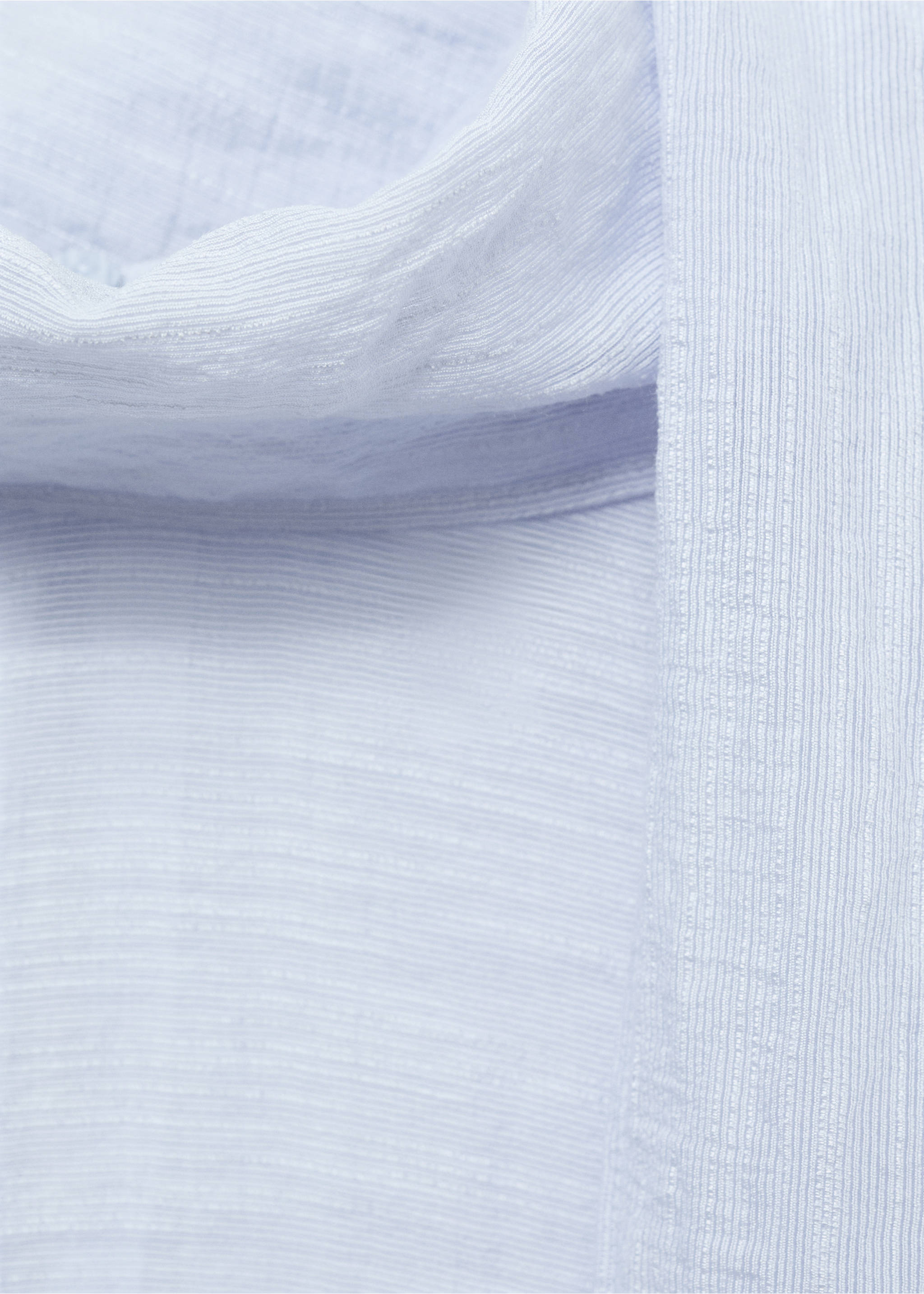 Close-up of a light blue blouse detail with textured fabric., Sky Blue. Ref: 17044138-00.