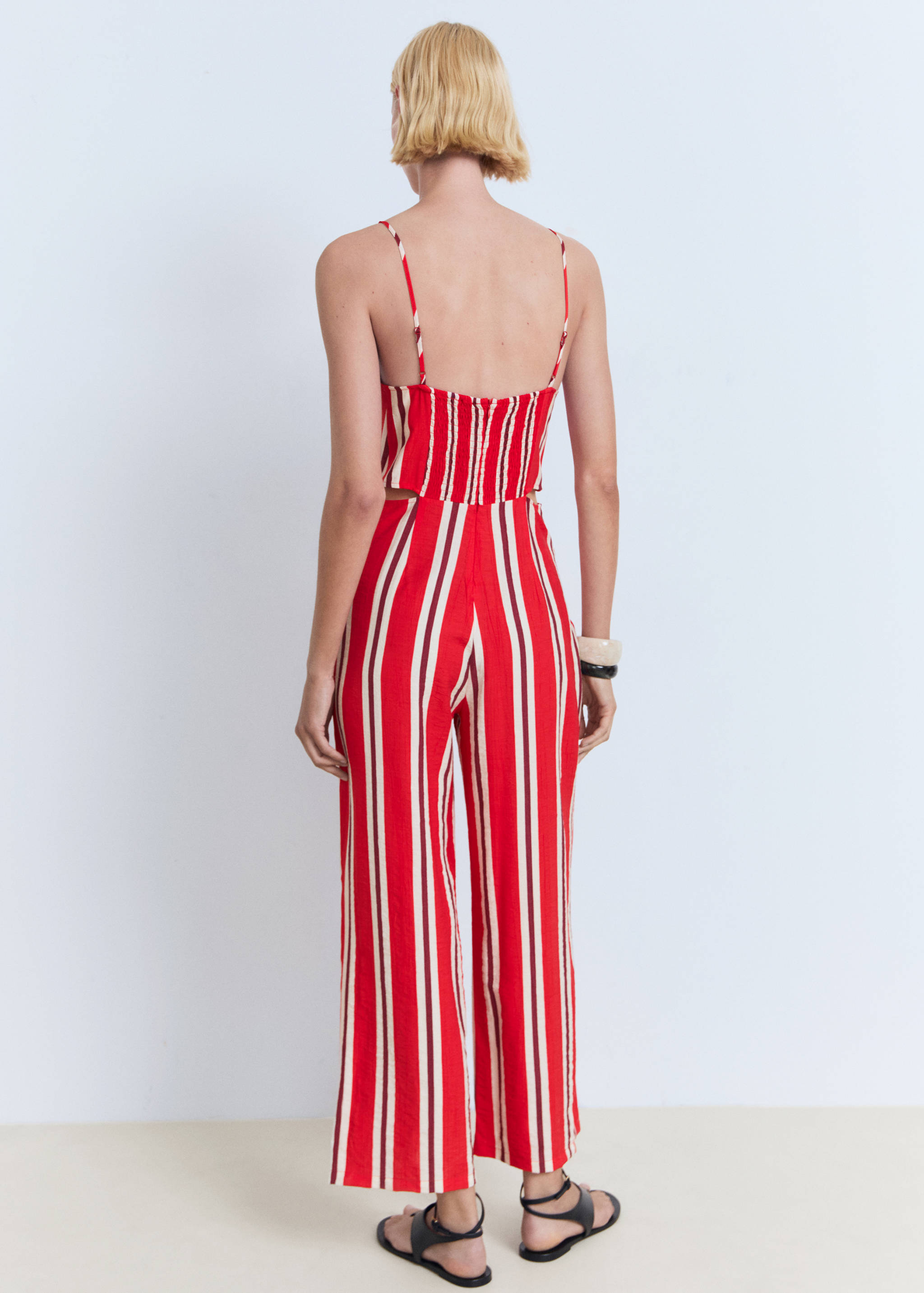 Striped jumpsuit with cut-out - Reverse of the article