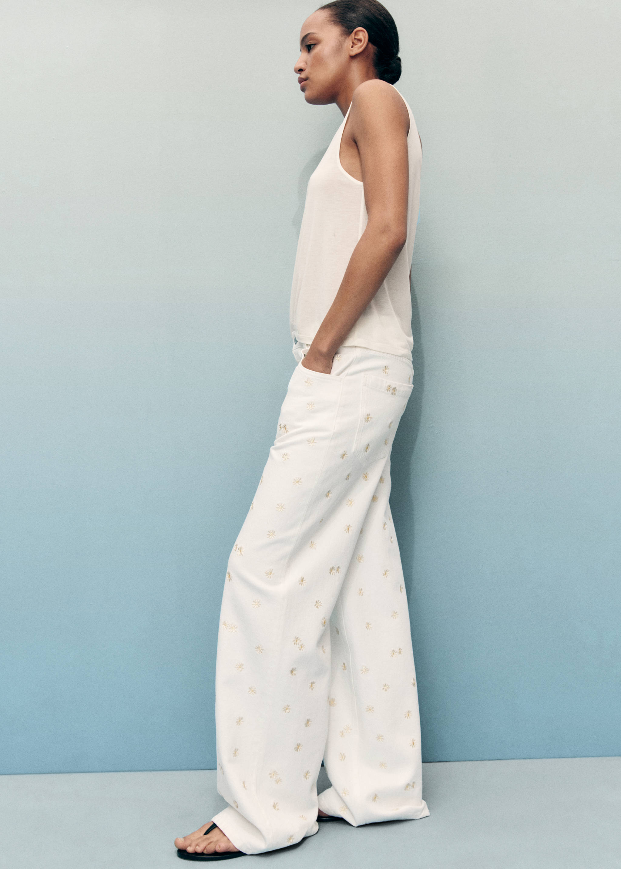 Flower-embroidered wide leg jeans - Details of the article 1