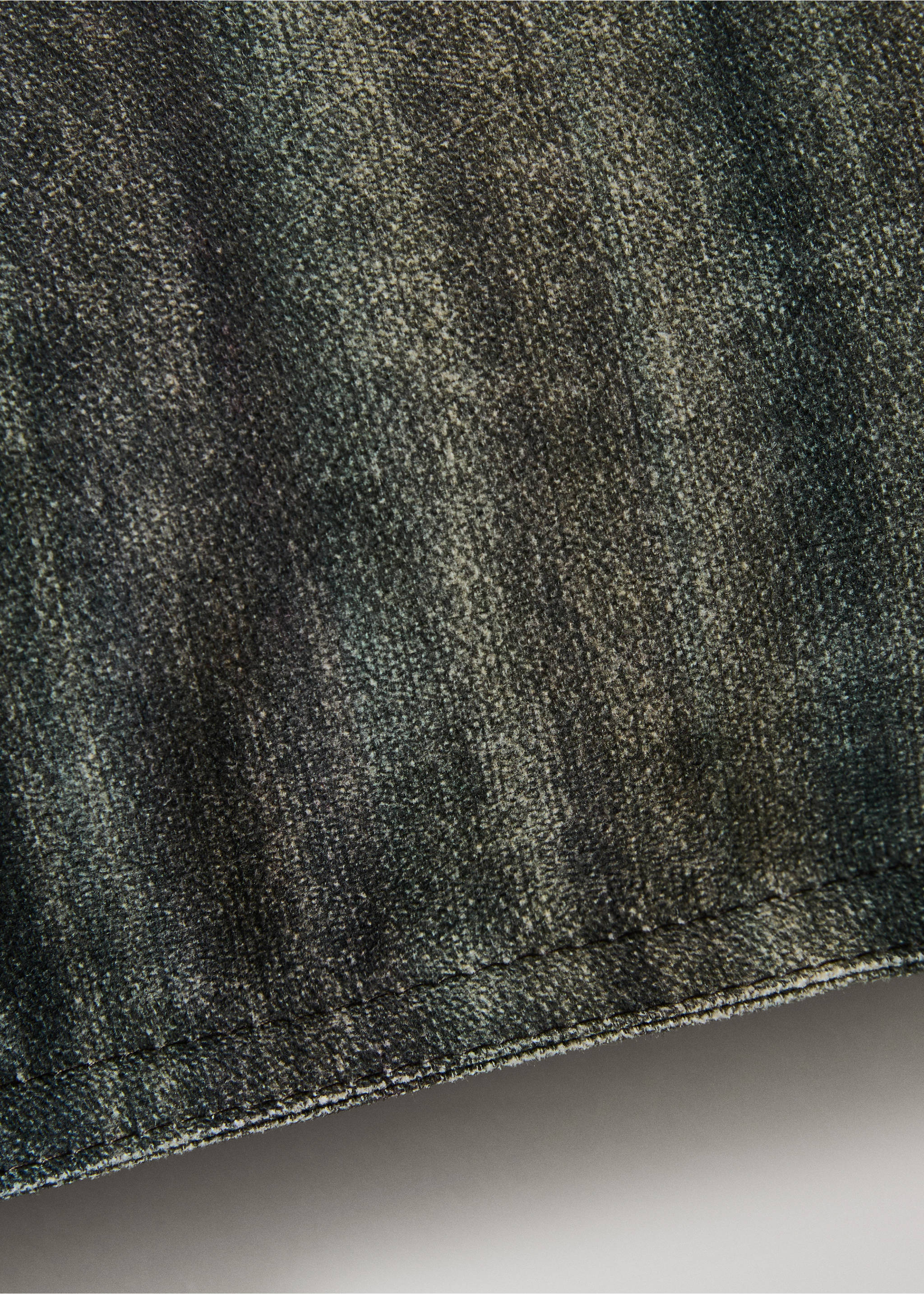Close-up of a cushion cover with a dark washed texture and stitched hem., Ink Blue. Ref: 17051590-00.