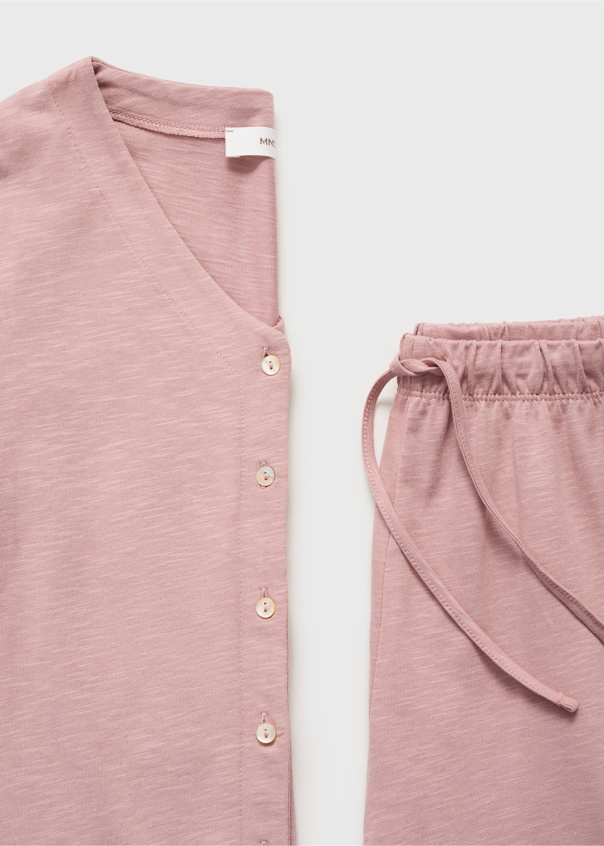 Pink cotton pyjama set featuring a button-up top and drawstring trousers., Pastel Pink. Ref: 17054776-00.