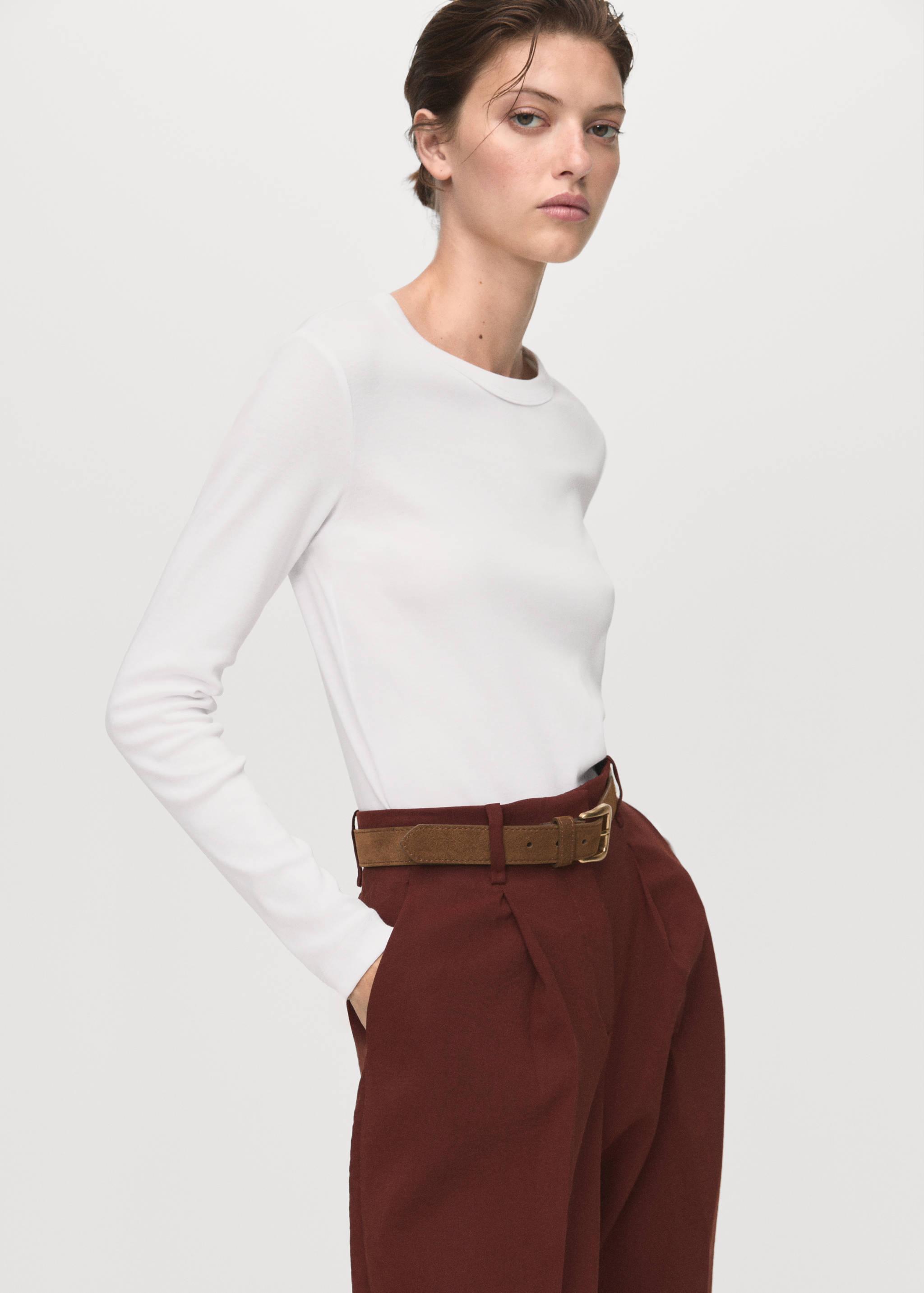 Long-sleeved white t-shirt with a round neckline.