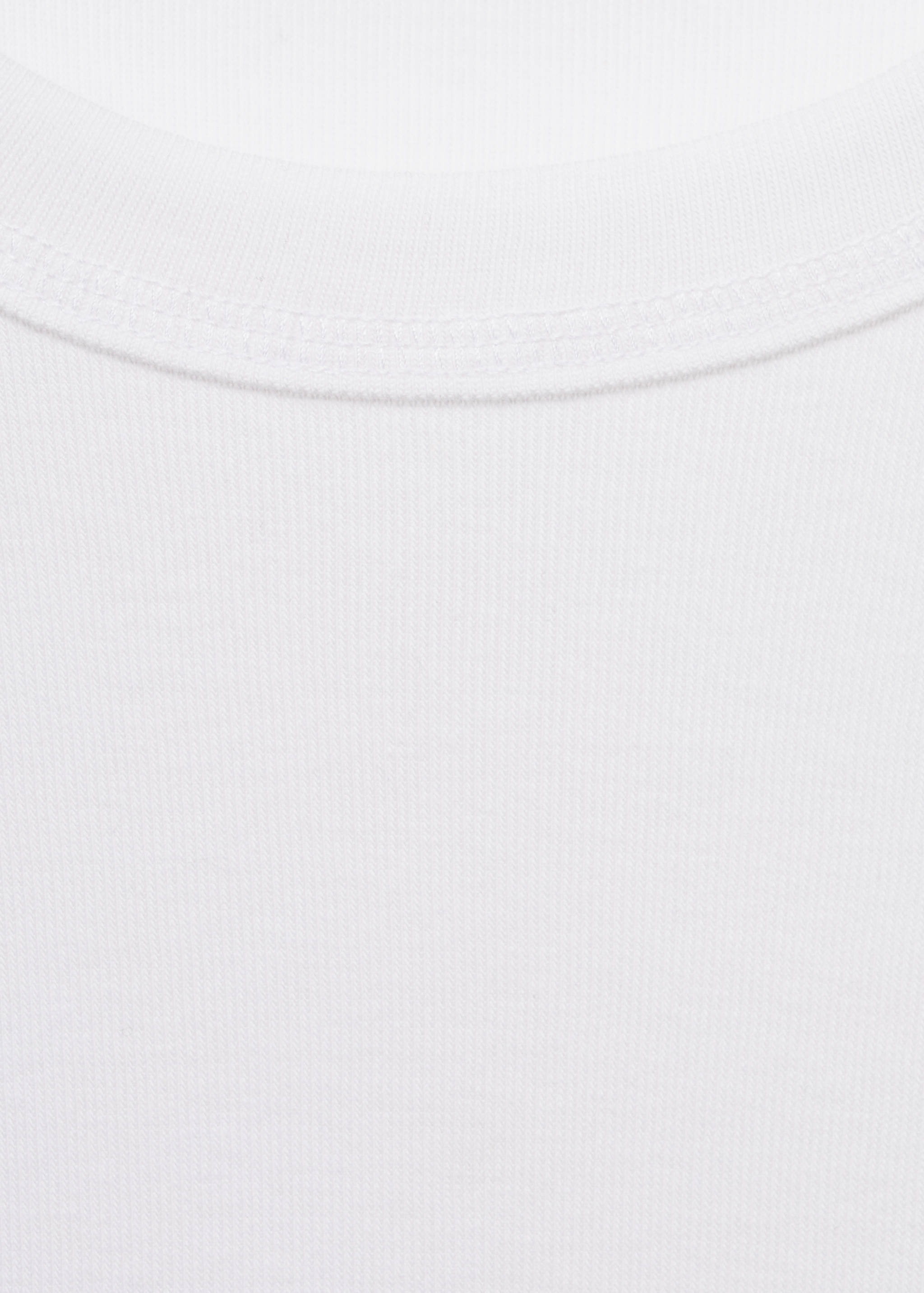 Close-up of white t-shirt fabric and ribbed crew neckline.
