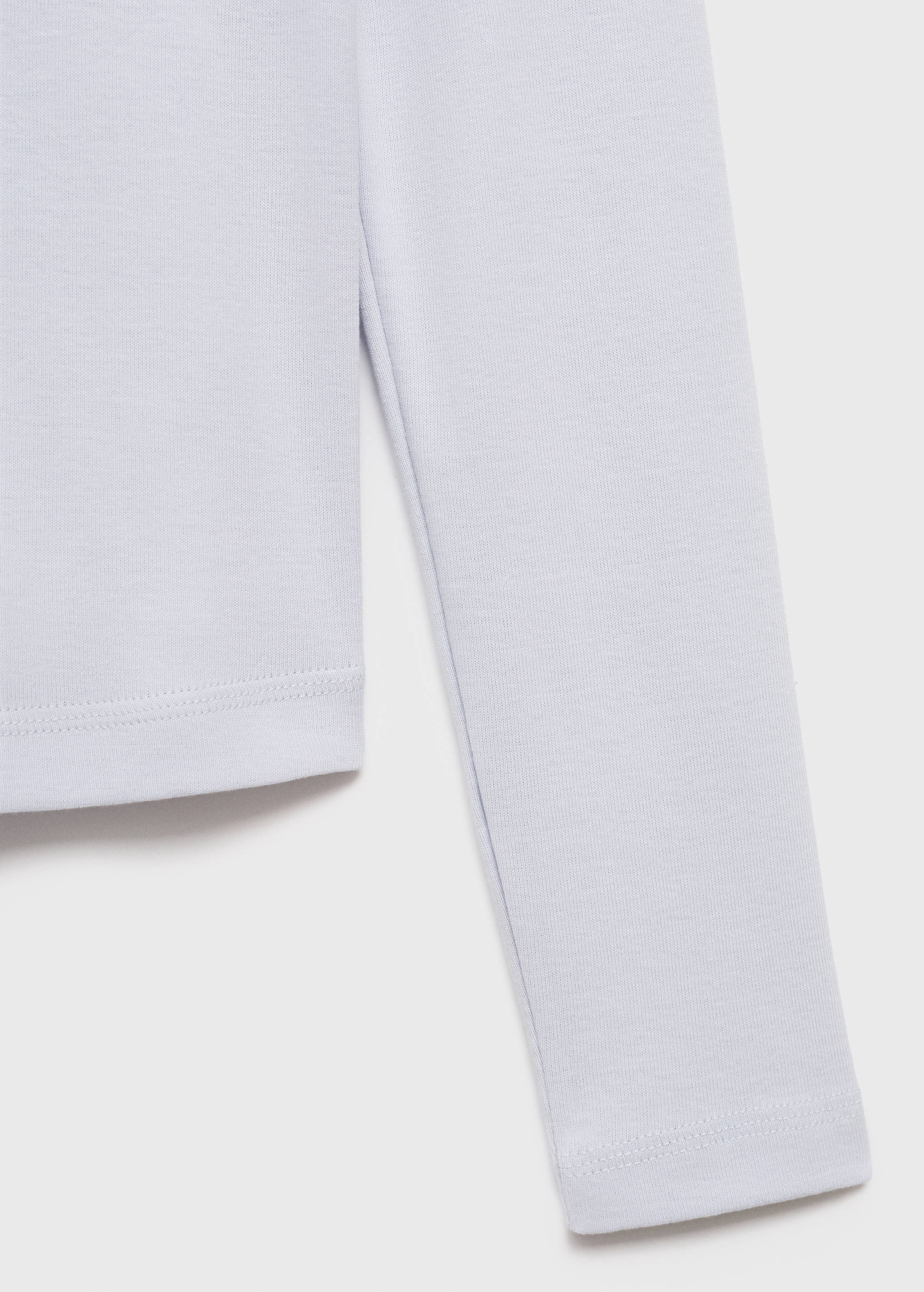 Close-up of light purple t-shirt fabric texture.