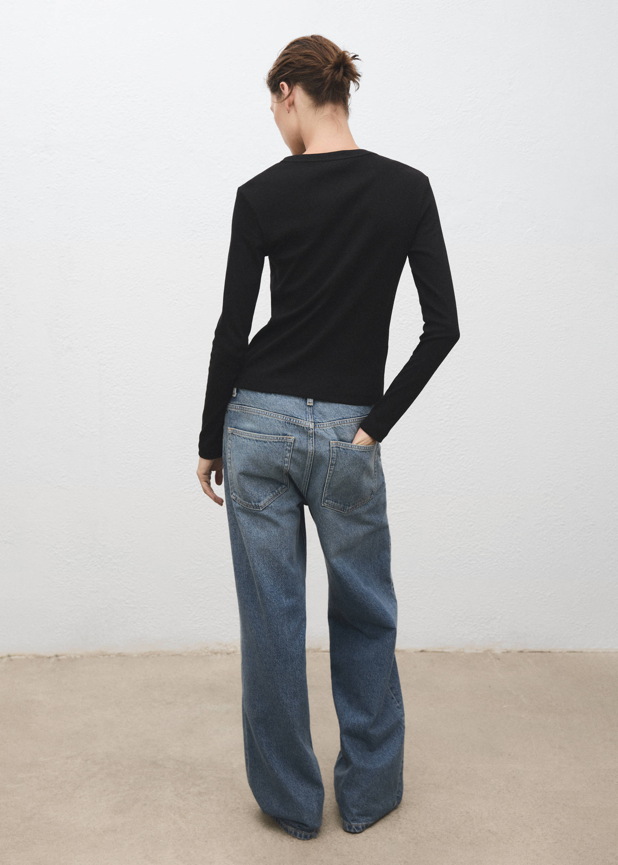 Black long-sleeved t-shirt, back view.