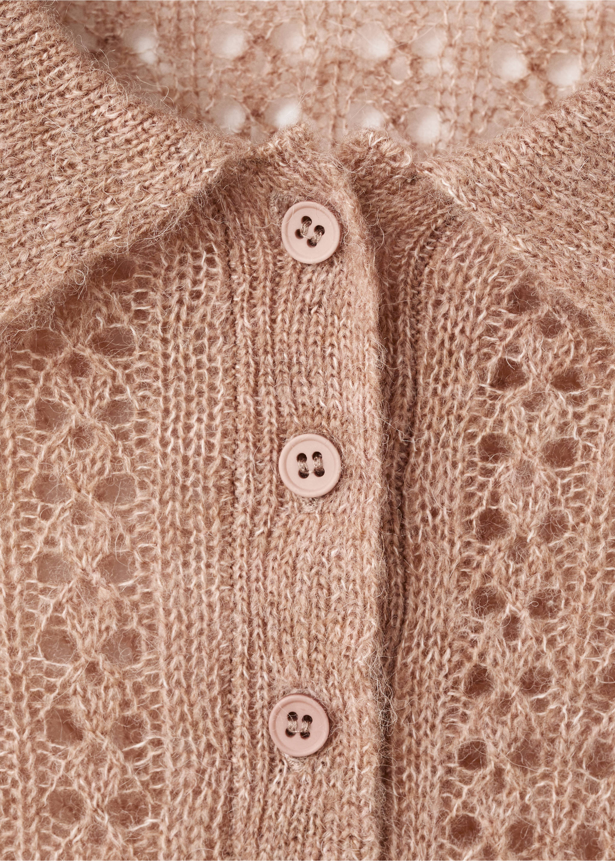 Close-up of a light brown open-work knit polo with a button placket., Medium Brown. Ref: 17055823-00.