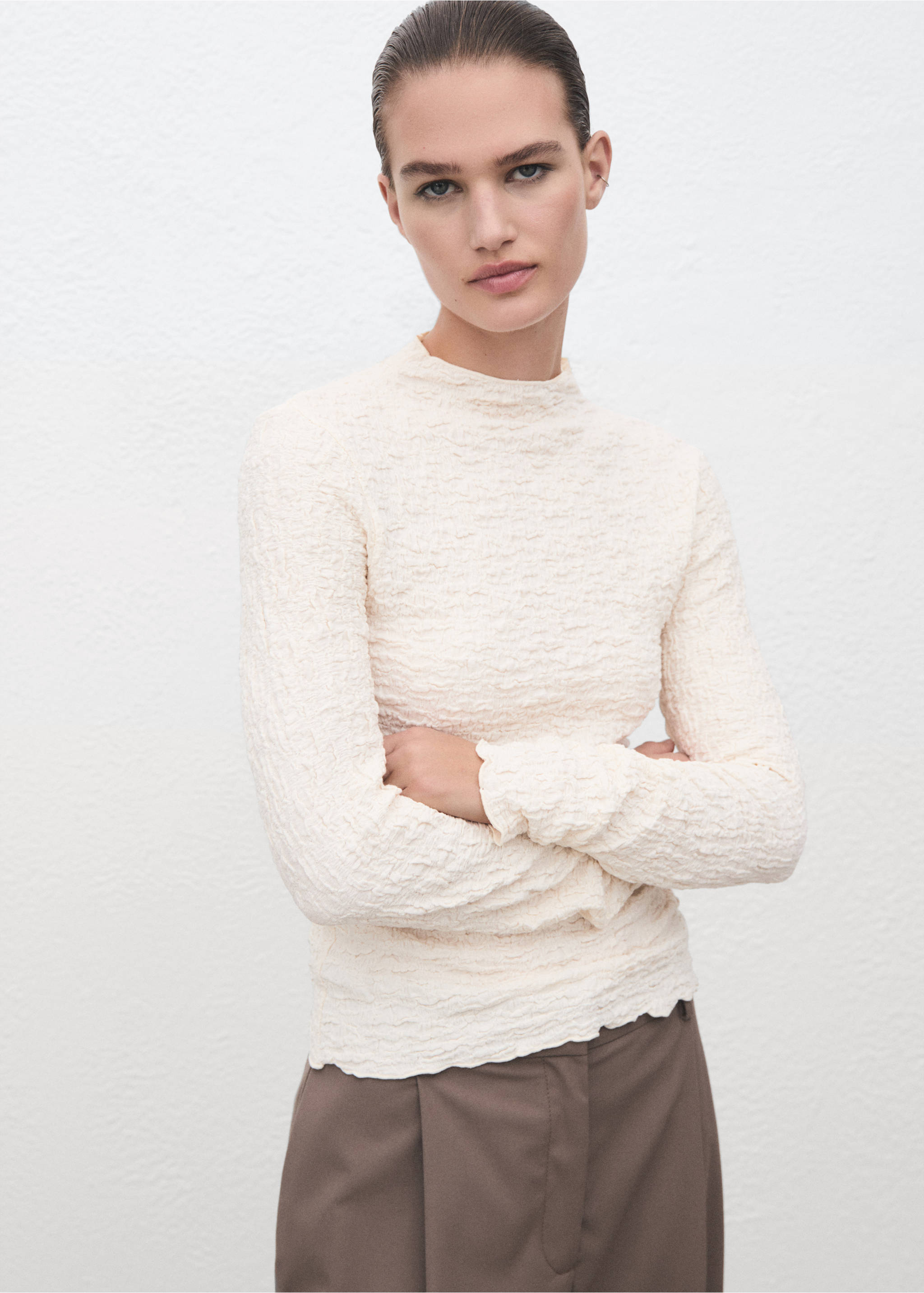 Cream textured long-sleeve top with a high neck and lettuce edges., Ecru. Ref: 17057793-00.