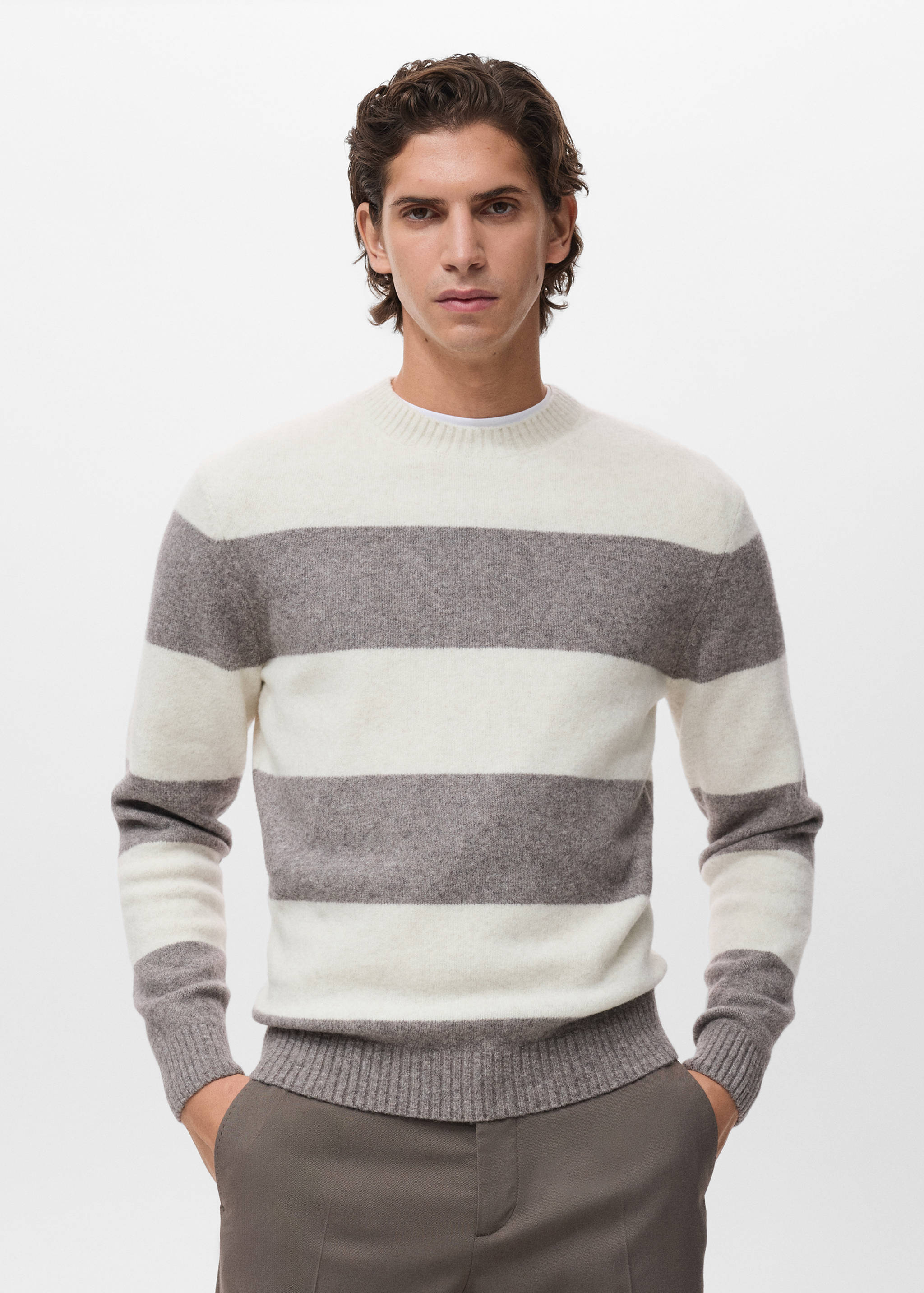 Off-white and grey striped crew neck jersey with long sleeves.