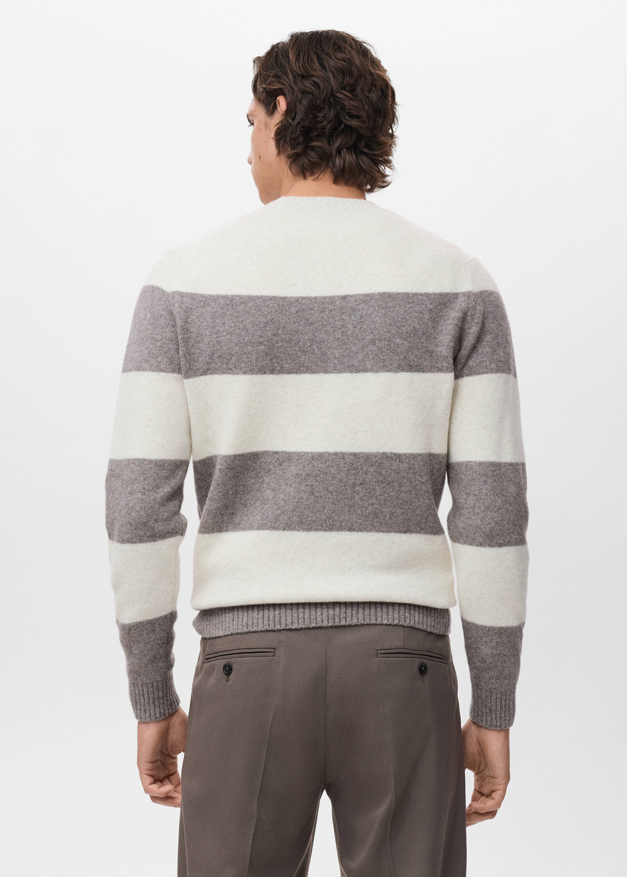 Back view of a striped crew-neck sweater in off-white and grey.