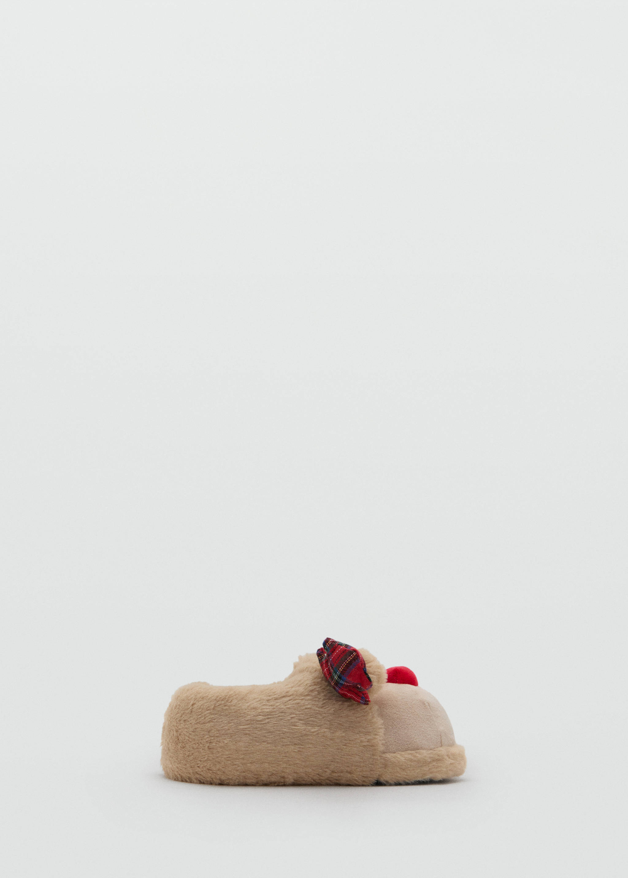 Beige faux-fur slippers with a tartan bow and red pom-pom.
