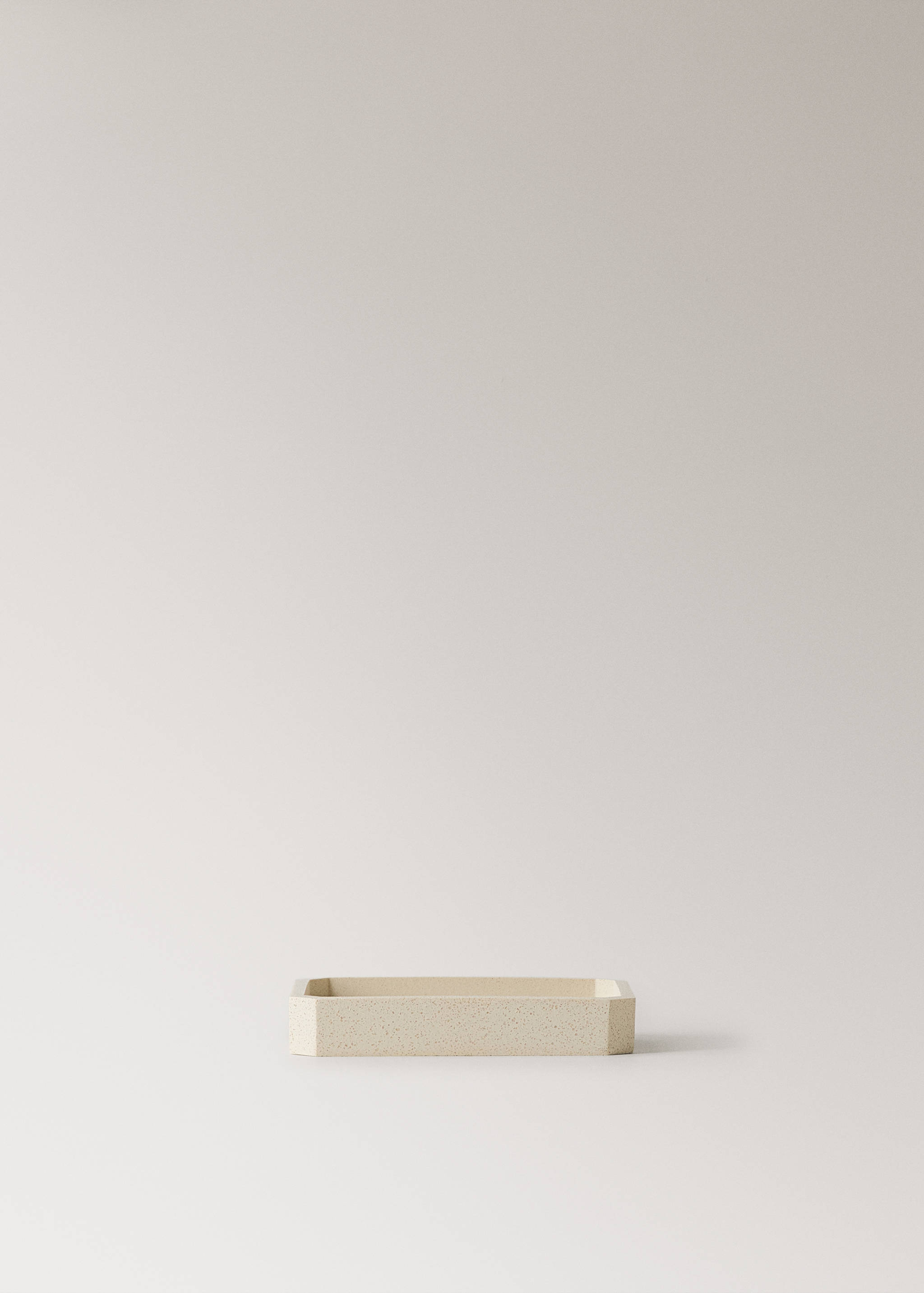 Light beige speckled soap dish.