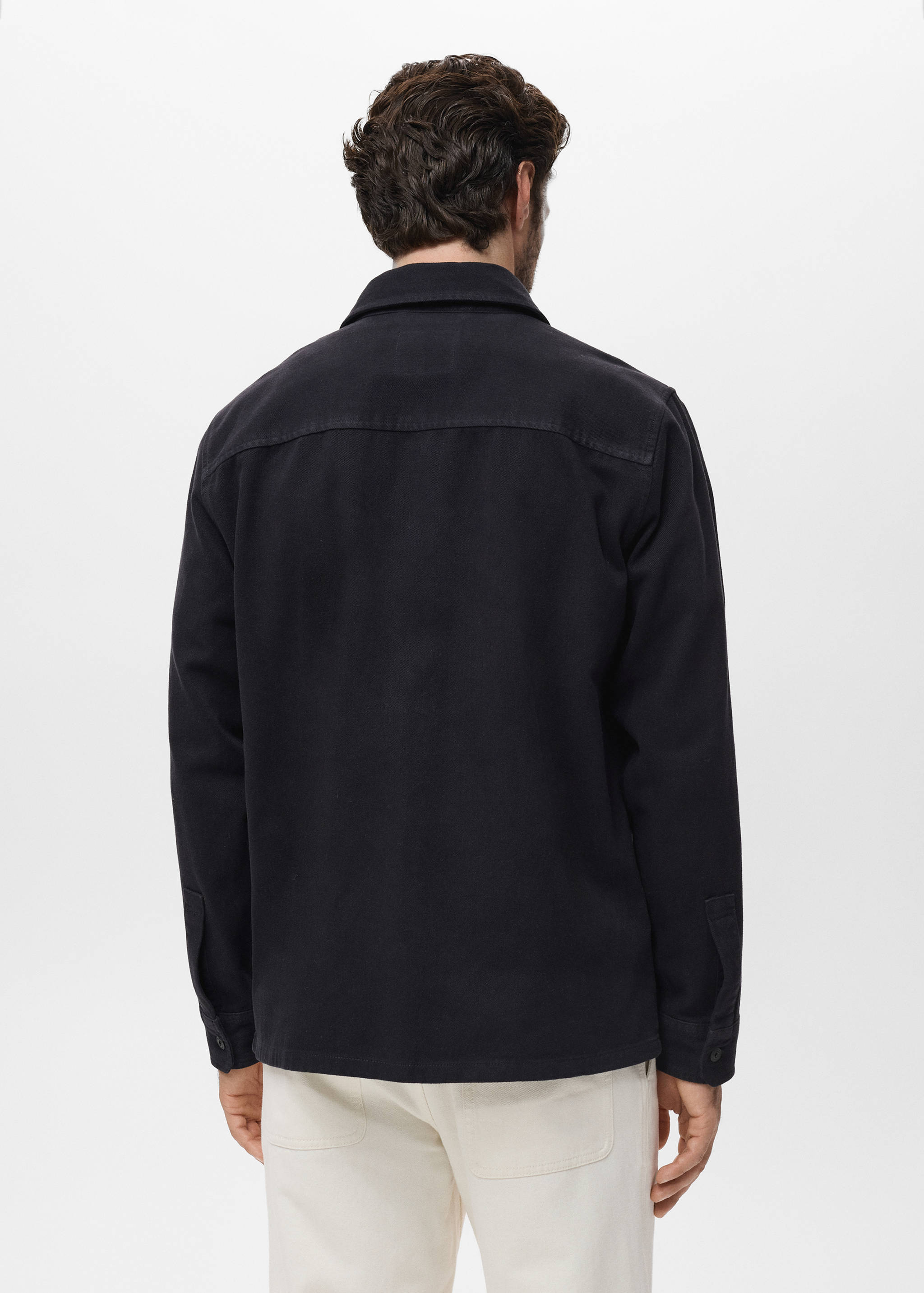 Denim overshirt pockets - Reverse of the article