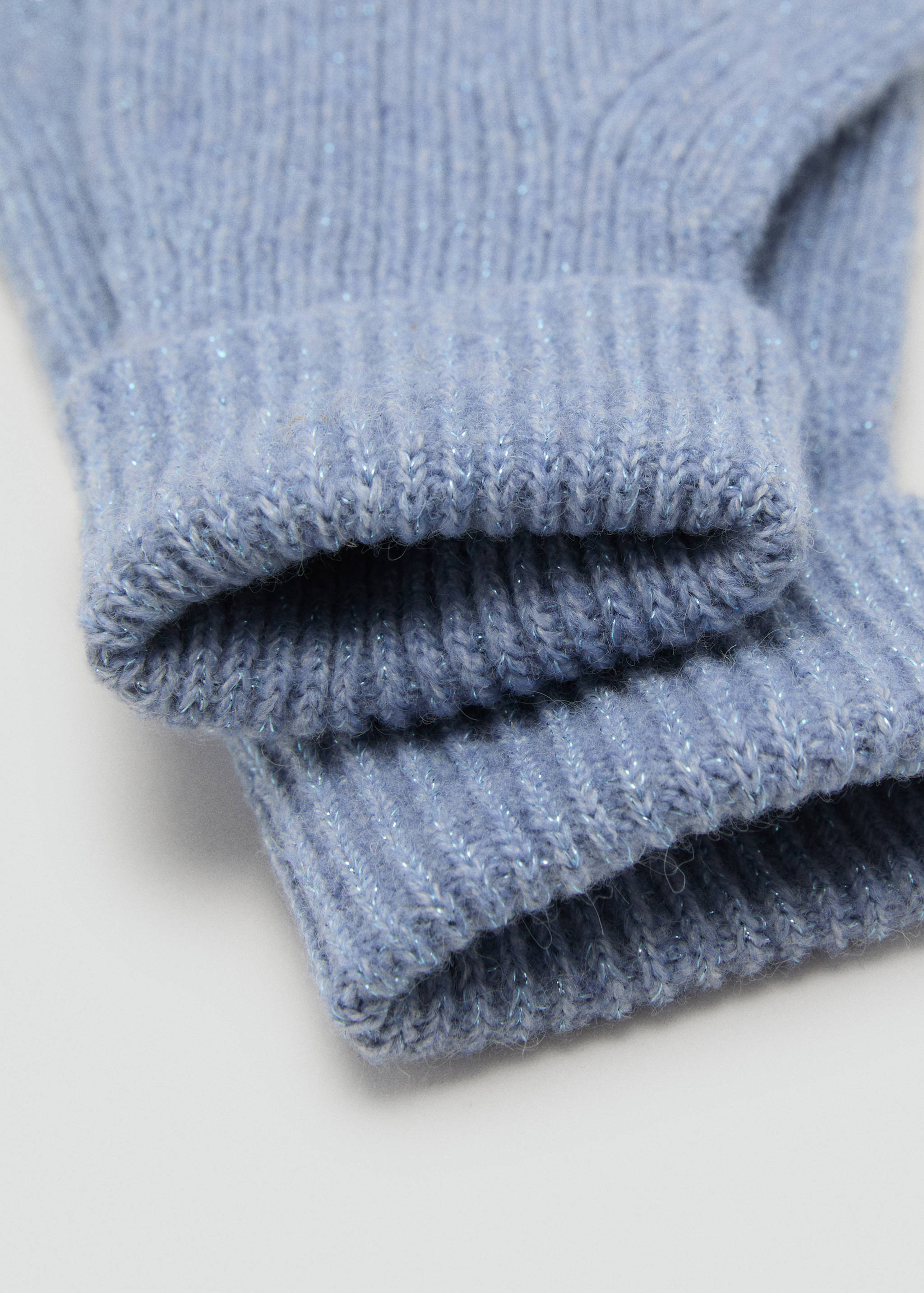 Light blue knitted gloves with a ribbed cuff and metallic thread.