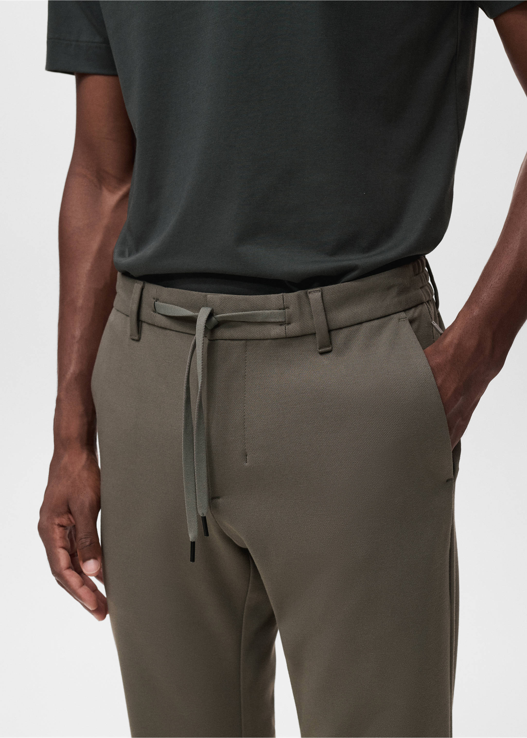 Khaki-green trousers featuring a drawstring waistband and belt loops, detailed view., Medium Brown. Ref: 17066326-00.