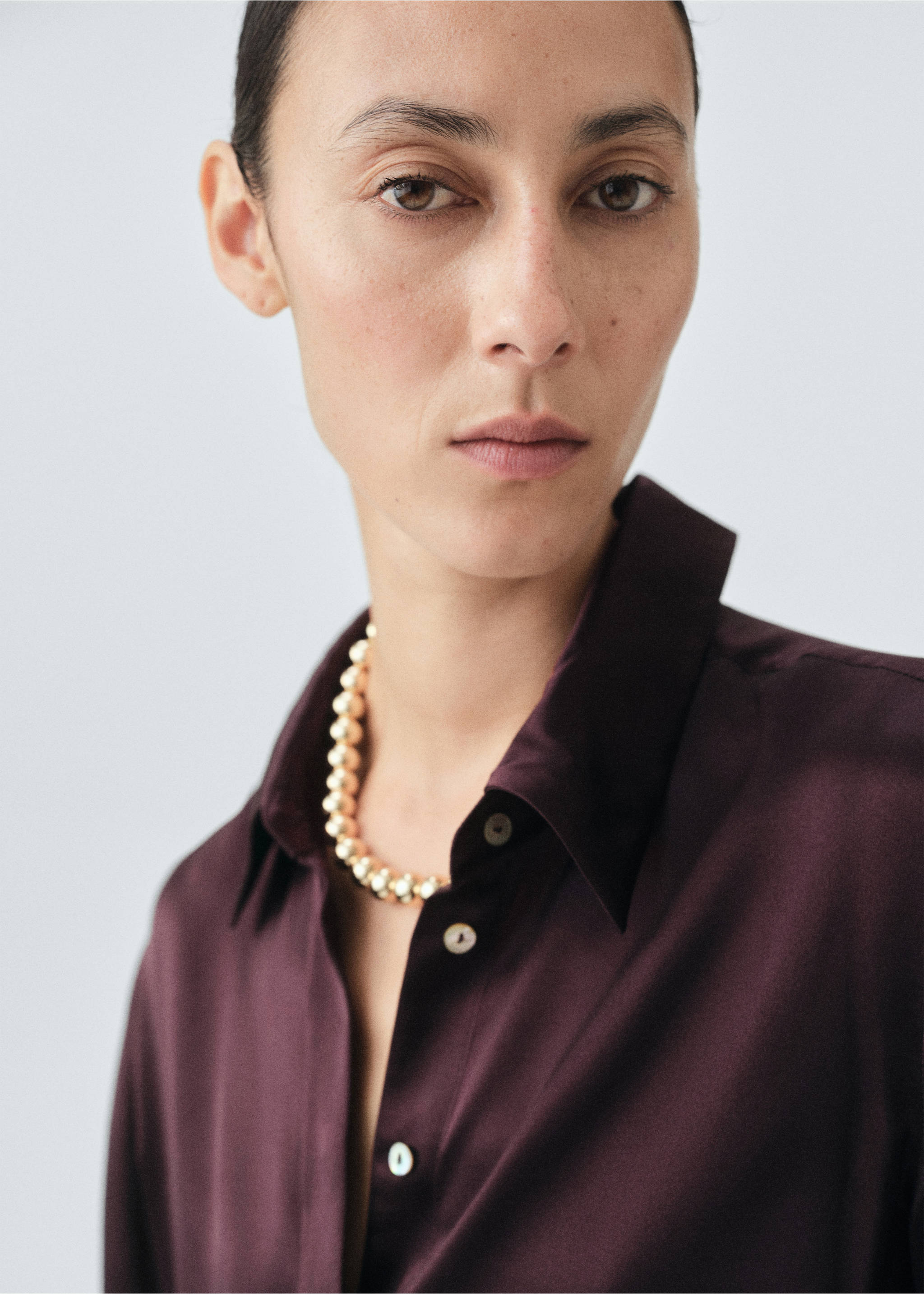 Close-up of a dark burgundy shirt with a classic collar., Medium Brown. Ref: 17066350-00.