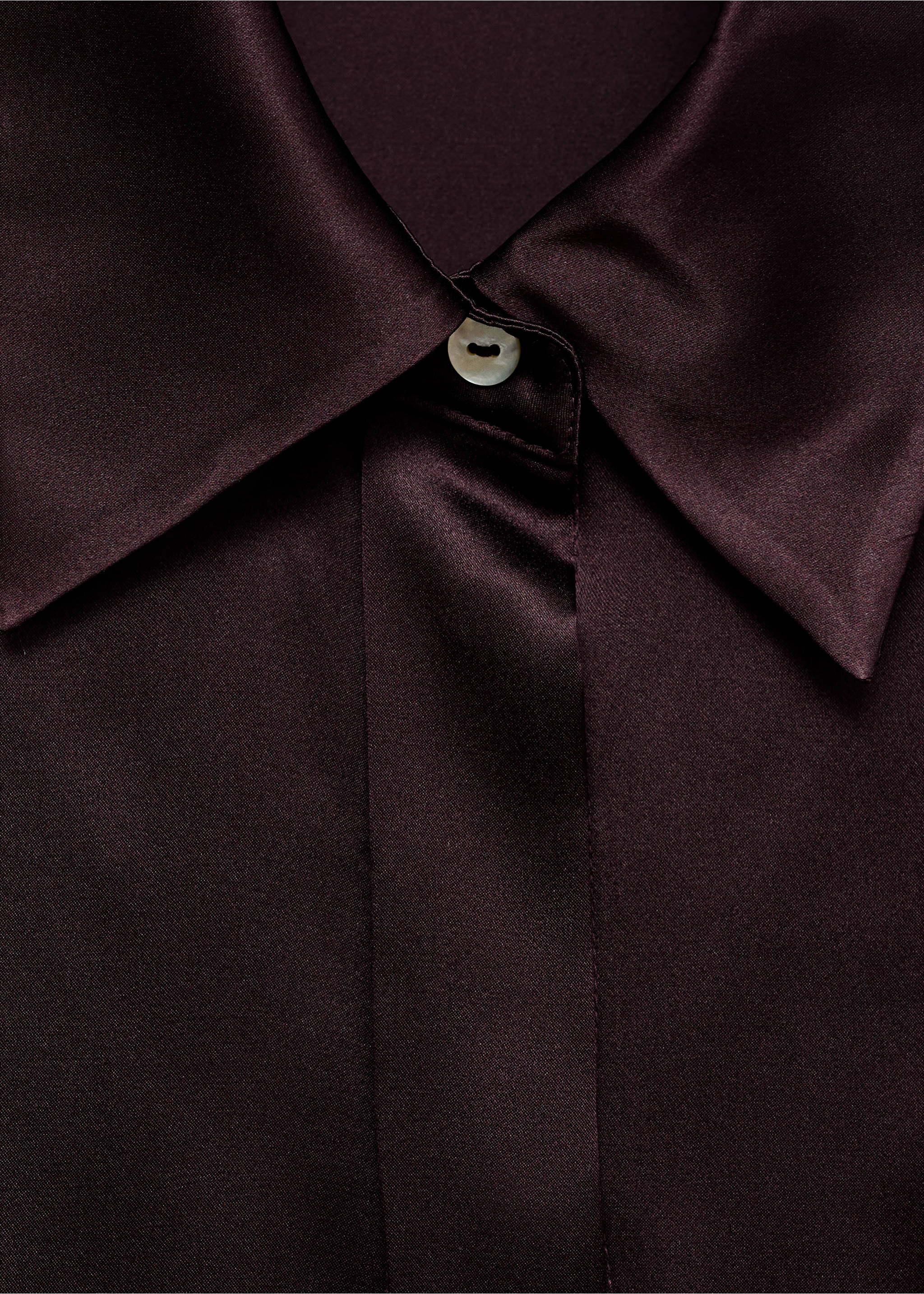 Close-up of a dark burgundy satin shirt collar and button detail., Medium Brown. Ref: 17066350-00.
