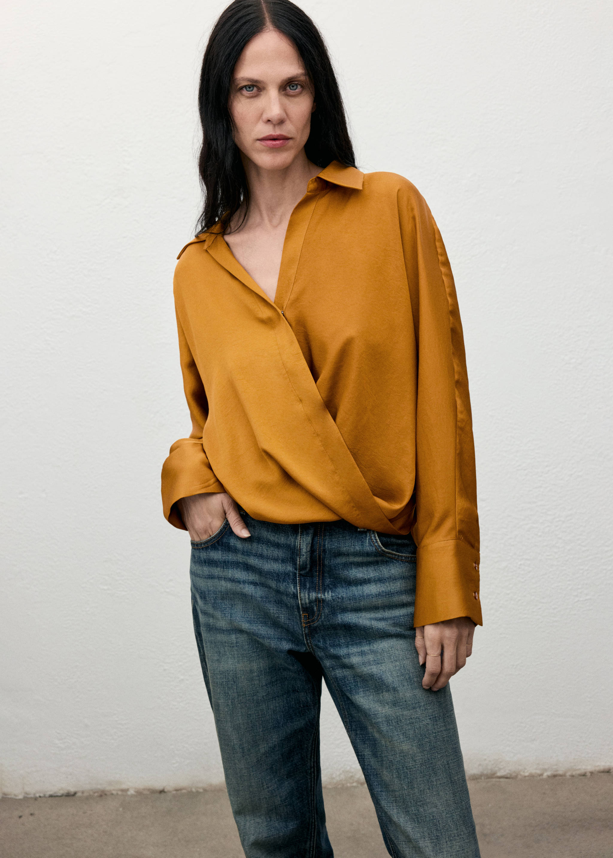 Mustard yellow wrap shirt with long sleeves and a V-neckline.
