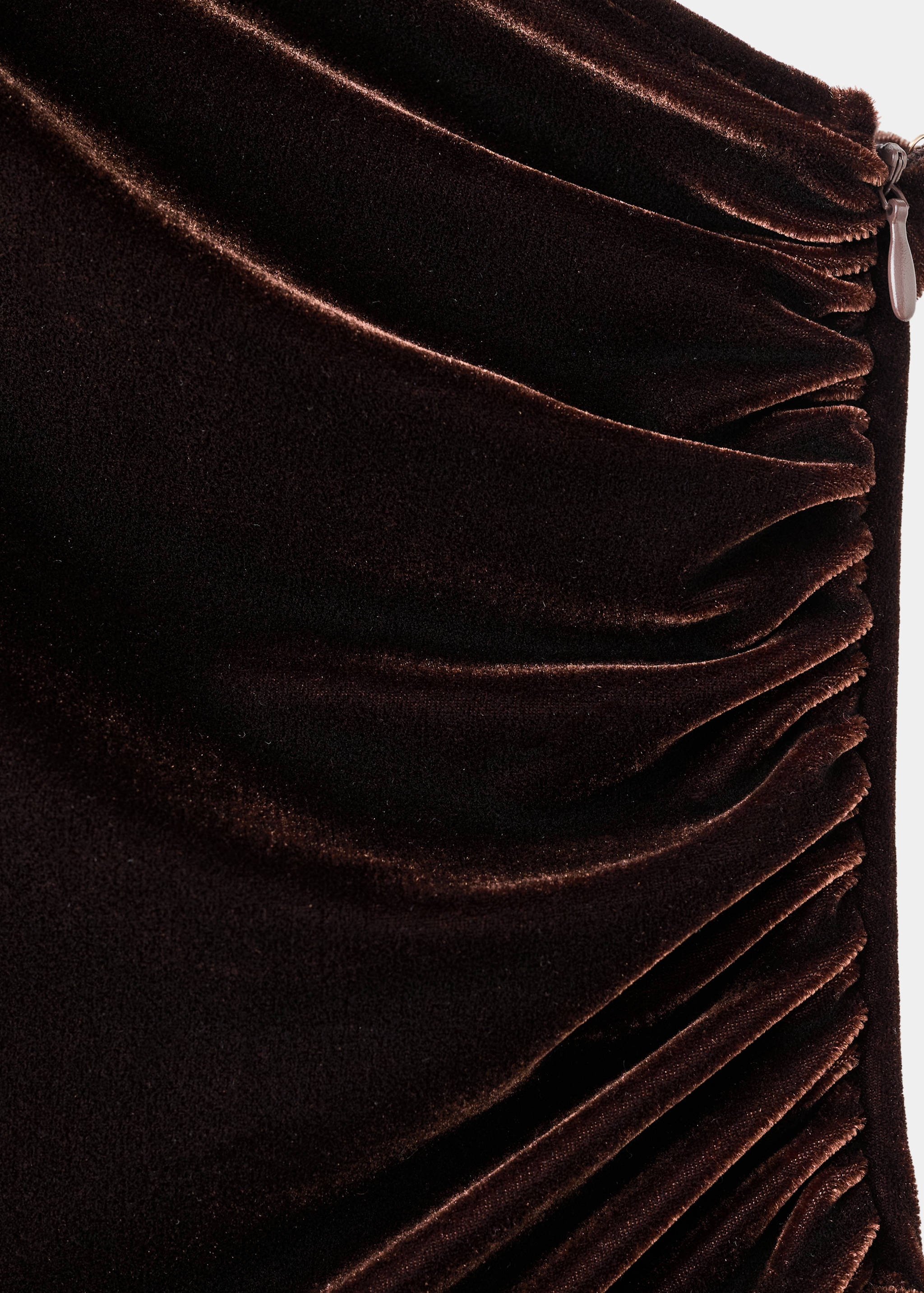 Brown velvet jumpsuit fabric detail showing diagonal ruching.