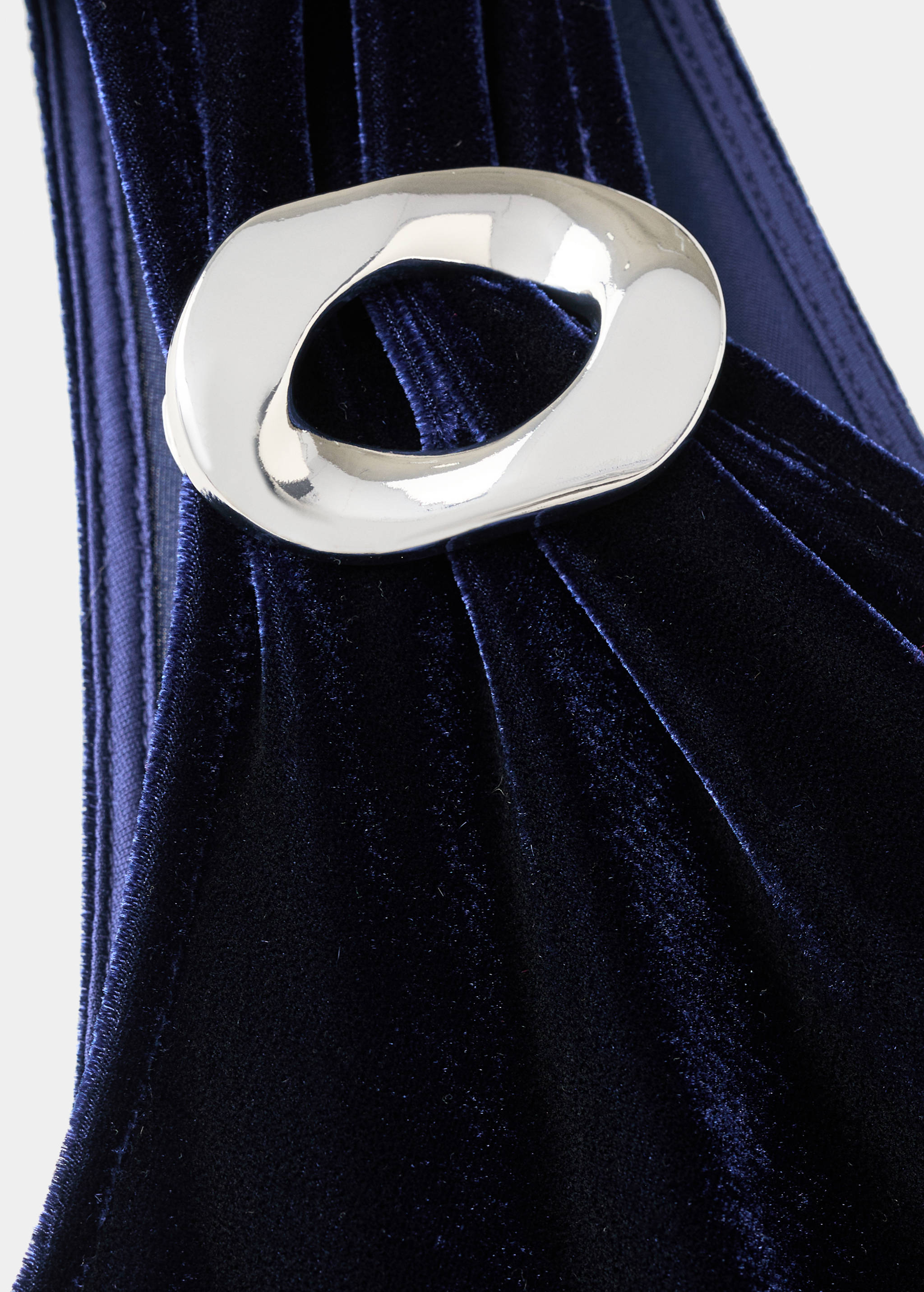 Navy blue velvet jumpsuit detail with a silver buckle