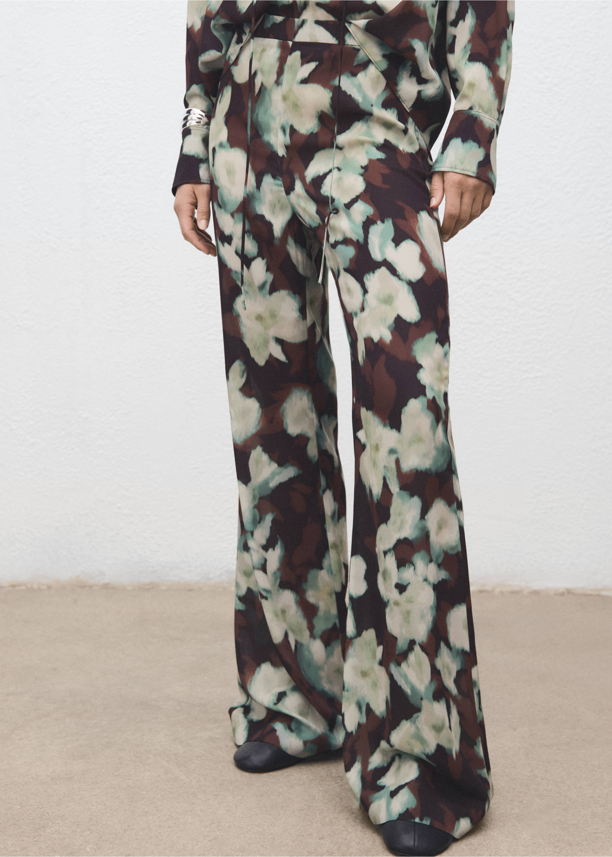 Brown floral wide-leg trousers with soft green and off-white abstract floral print., Green. Ref: 17067815-00.