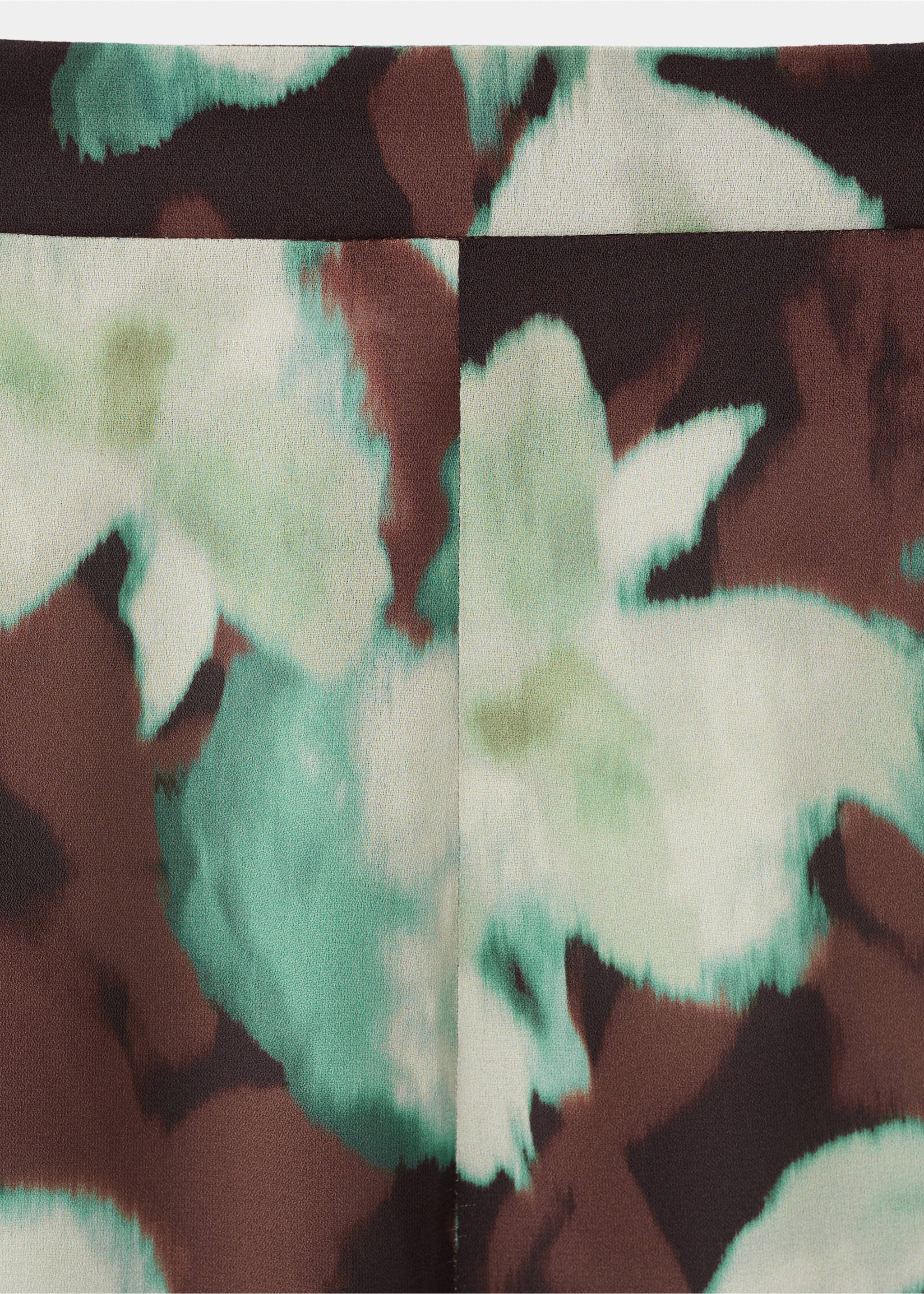 Close-up of printed trousers with an abstract watercolour floral pattern., Green. Ref: 17067815-00.