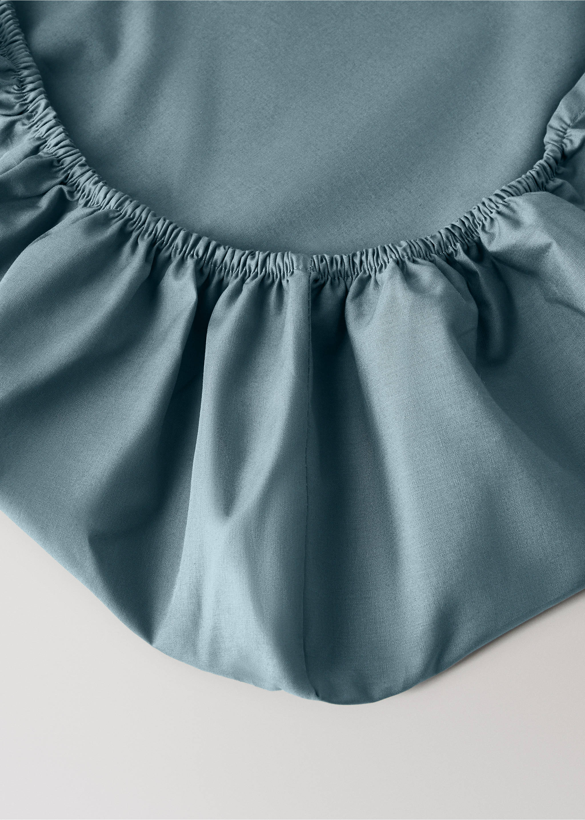 Teal cot fitted sheet with an elasticated edge., Blue. Ref: 17071545-00.