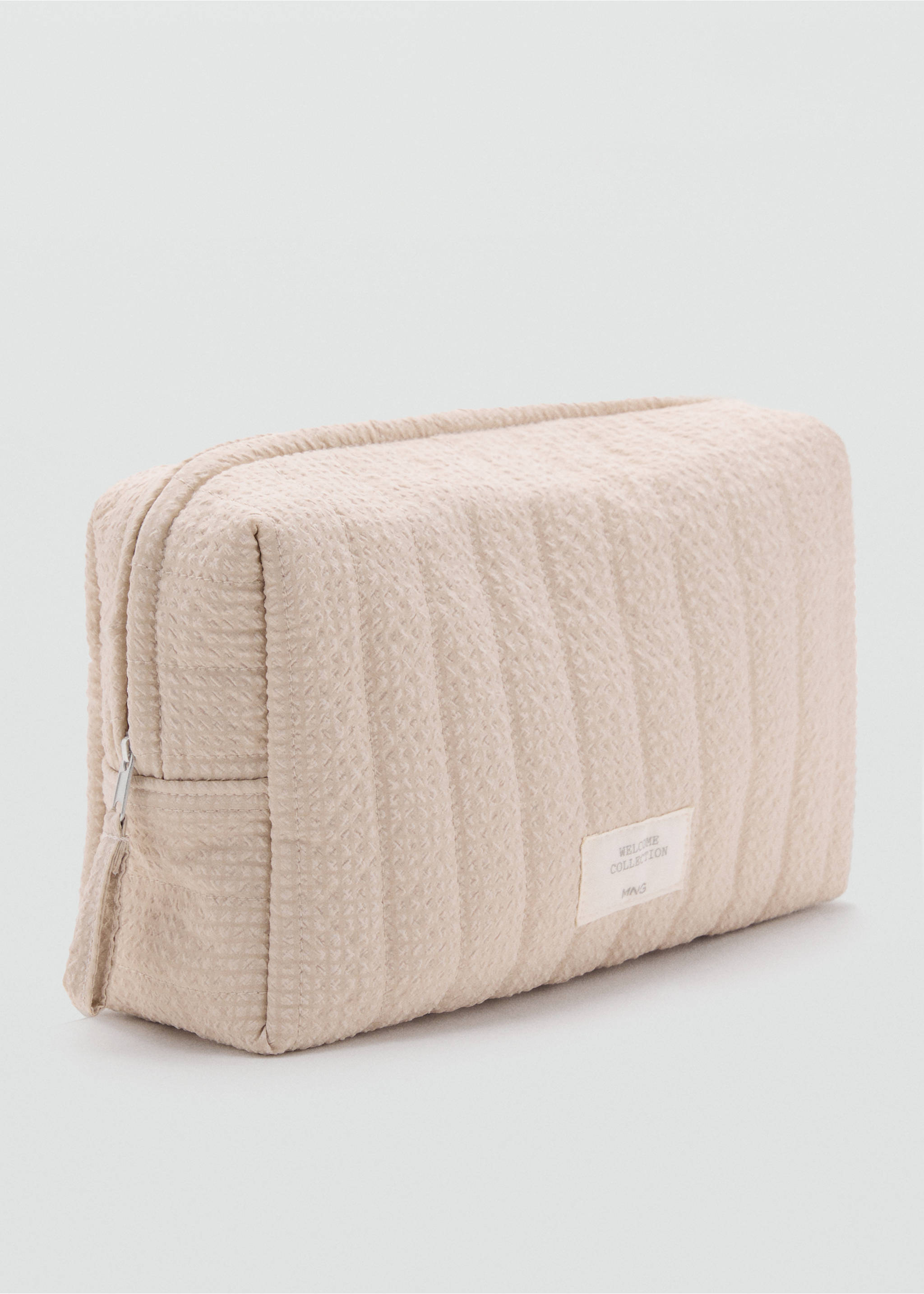Textured cosmetics bag - Medium plane, Sand. Ref: 17073316-00.