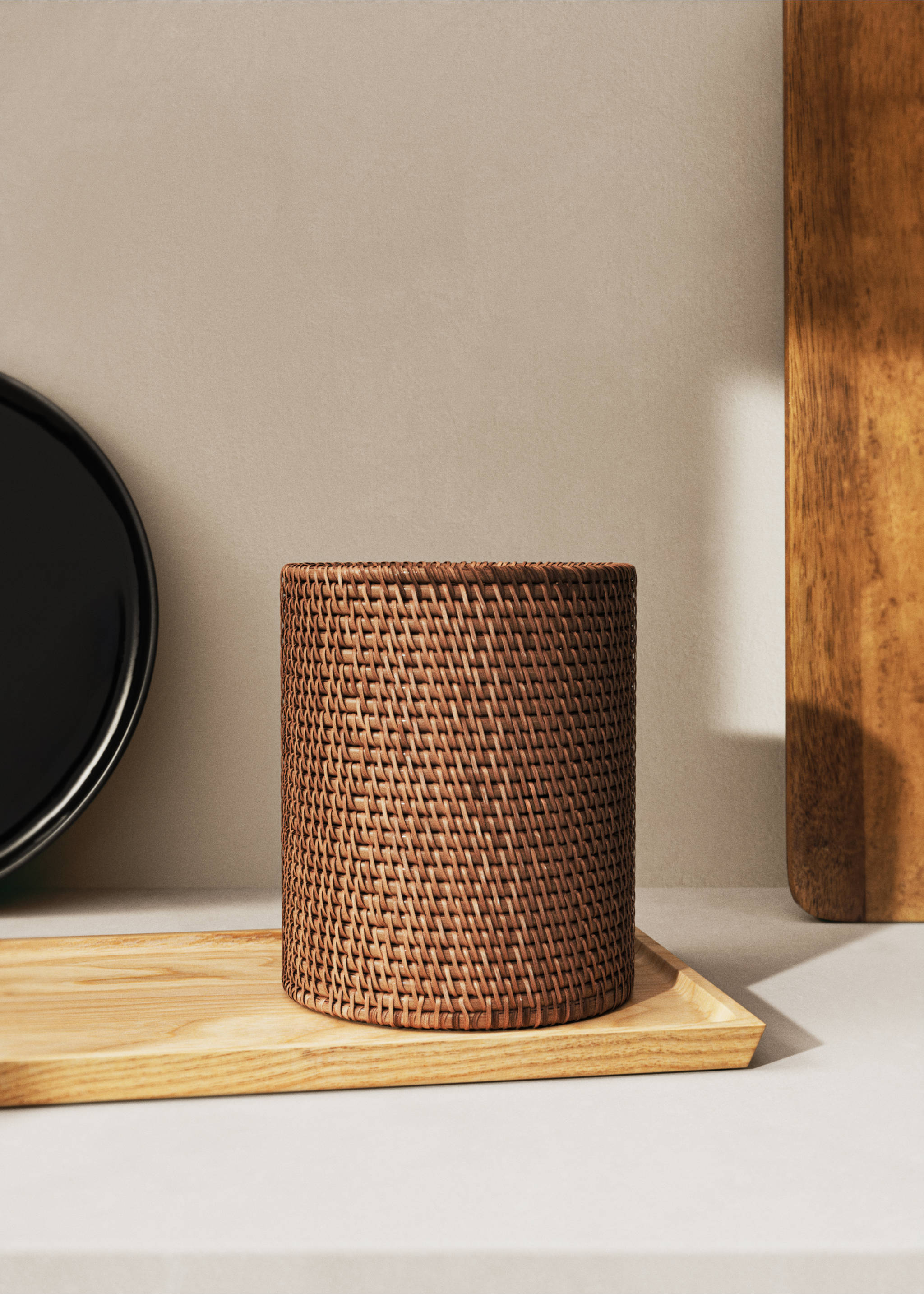Cylindrical brown woven rattan container on a wooden tray., Brown. Ref: 17074784-00.