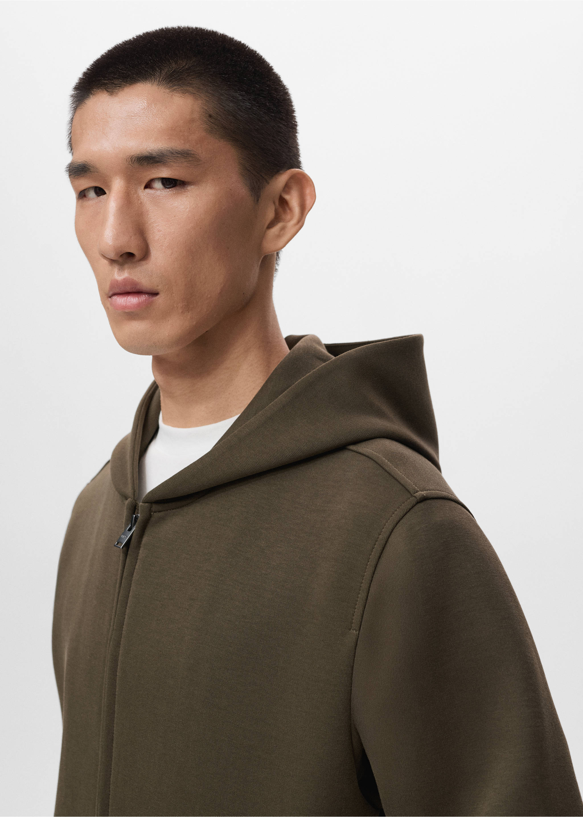 Olive green zipped hoodie with hood, close-up view on model, Olive Green. Ref: 17075998-00.