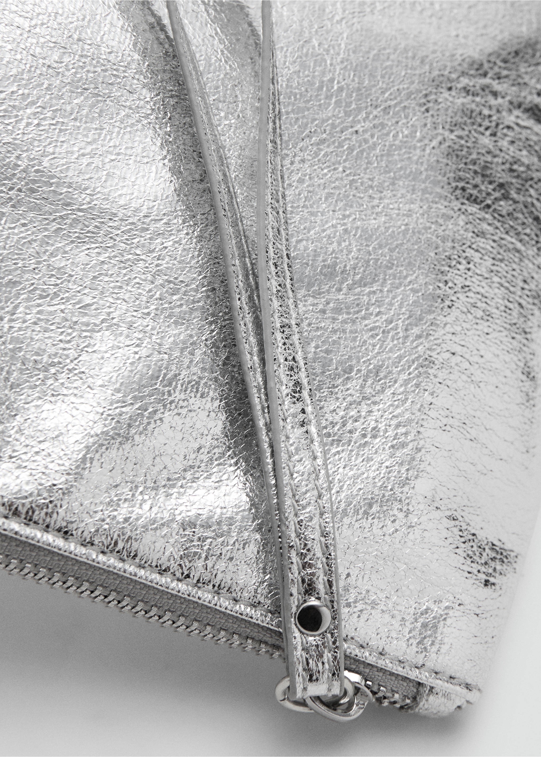 Close-up of a silver metallic gadget accessory with a zip closure., Silver. Ref: 17077890-00.