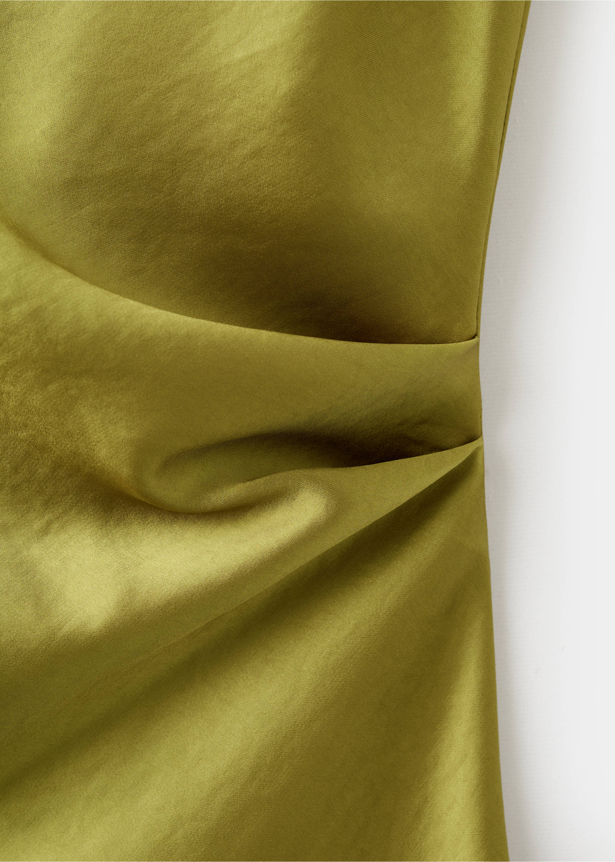 Close-up of the smooth, gathered fabric detail on a green blouse., Yellow. Ref: 17079104-00.