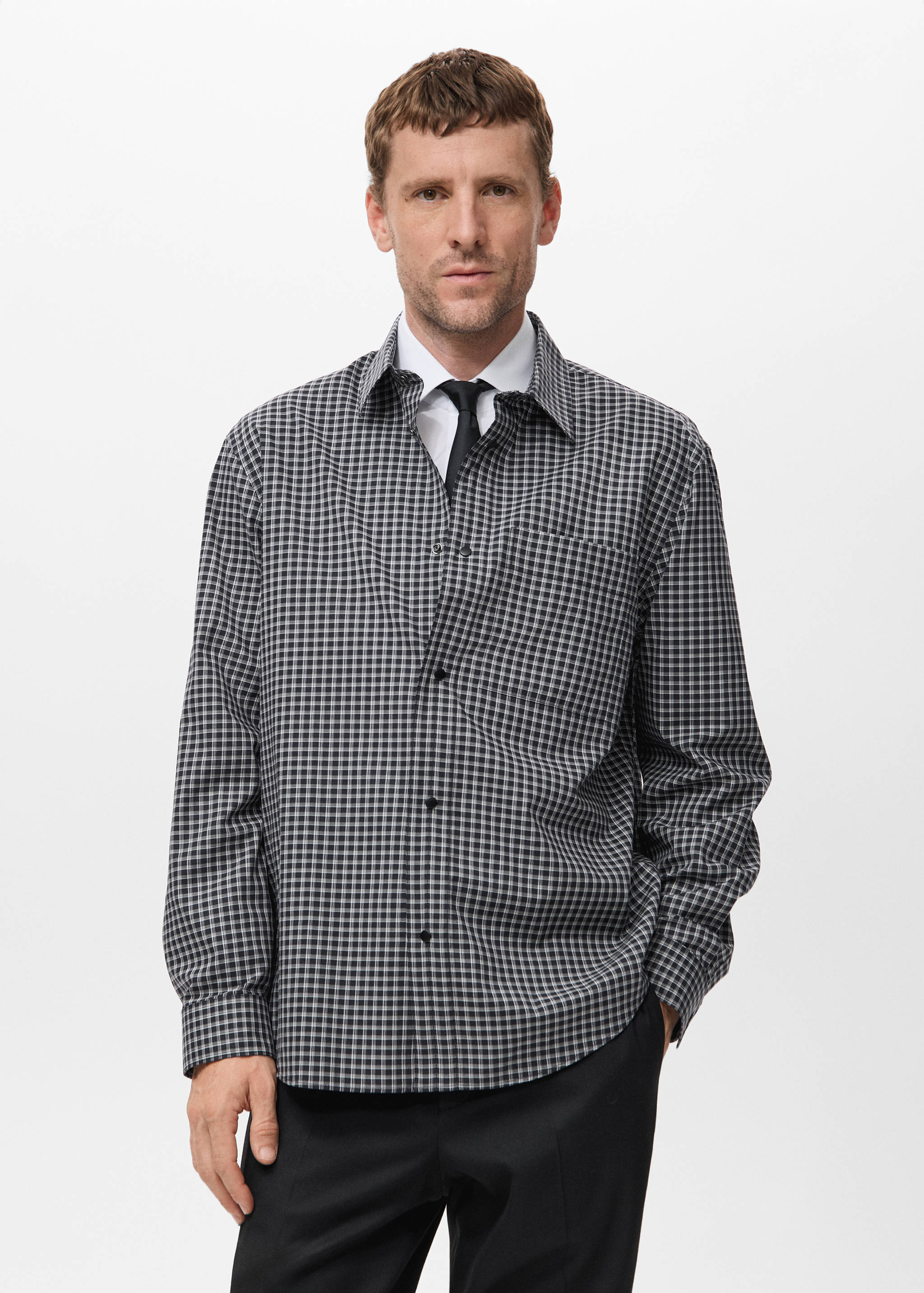 Black and white gingham check shirt with long sleeves and a classic collar.