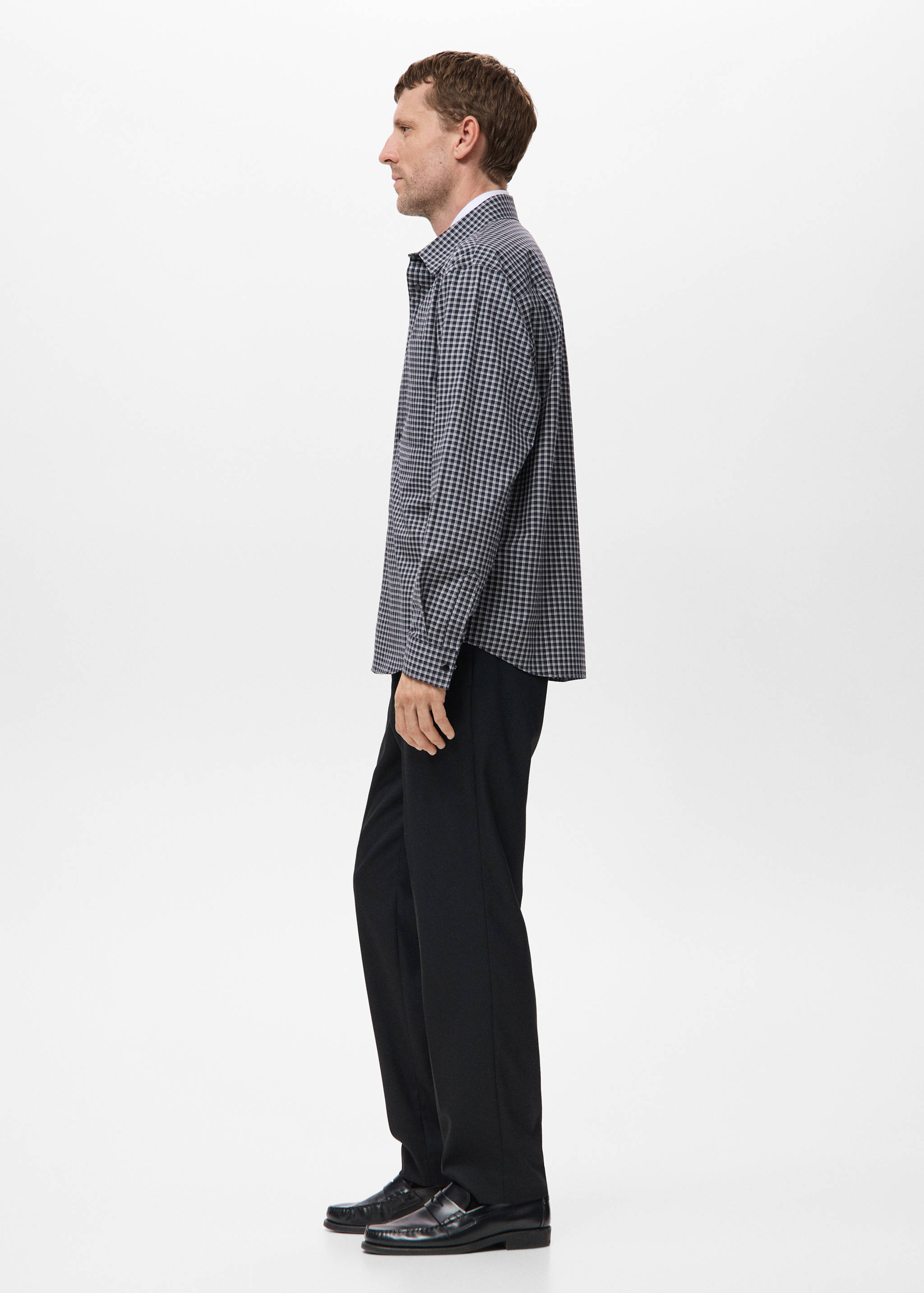 Black and white gingham check shirt with long sleeves and a classic collar.