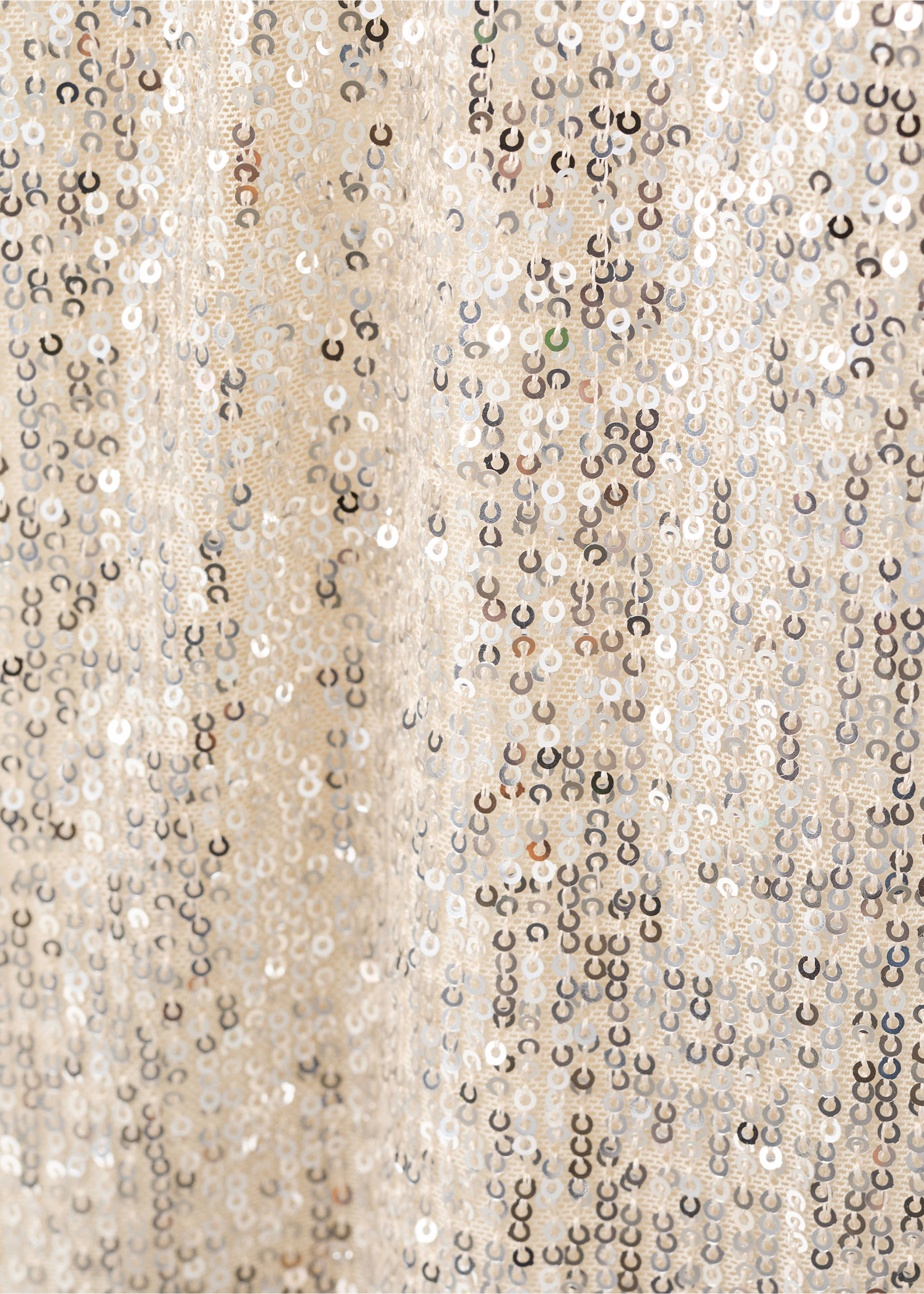 Close-up of a sequinned dress fabric with silver sequins on mesh., Ivory White. Ref: 17079805-00.