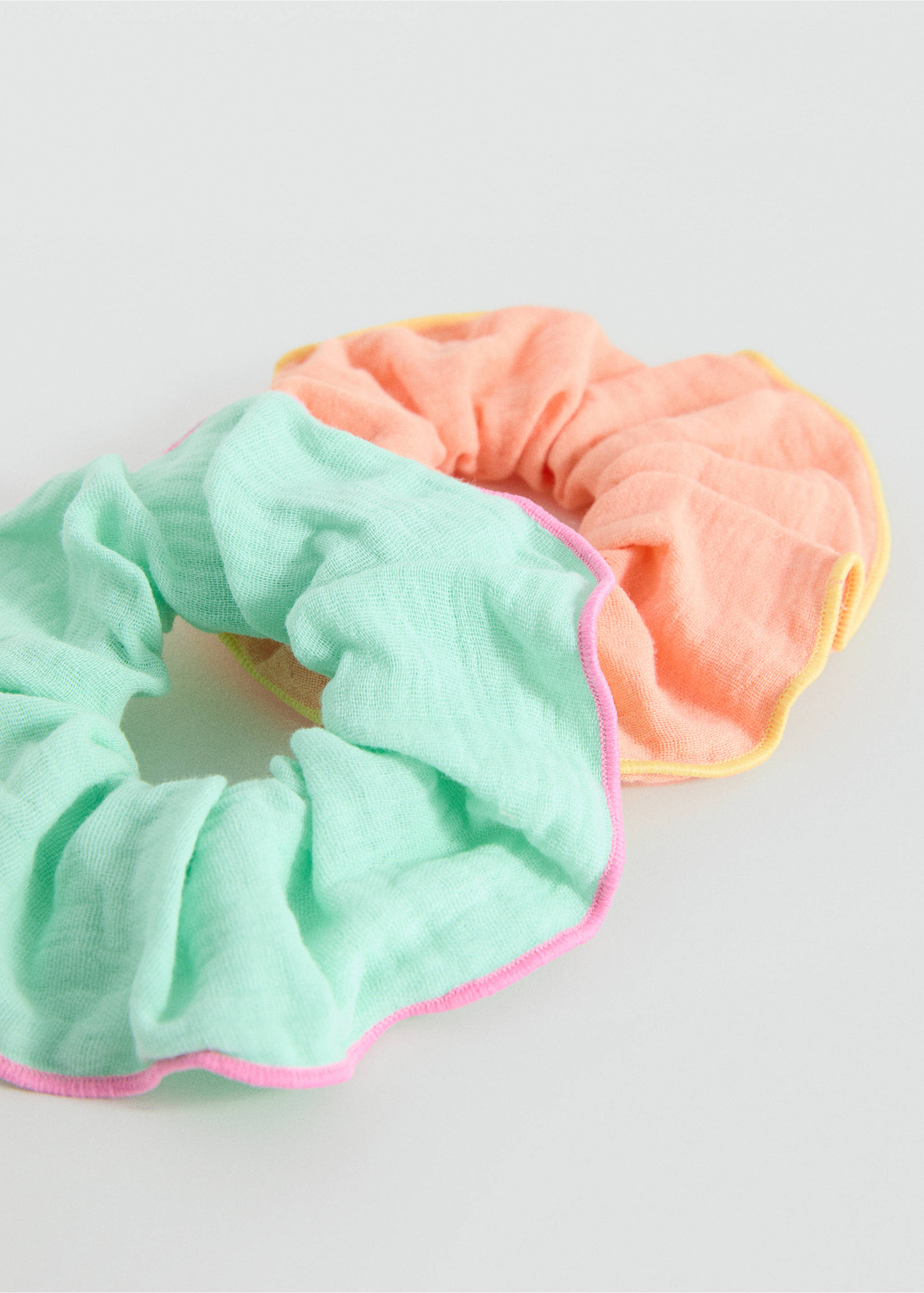 Set of two gathered fabric hair scrunchies in light green and peach with contrasting trim., Aqua Green. Ref: 17081158-00.