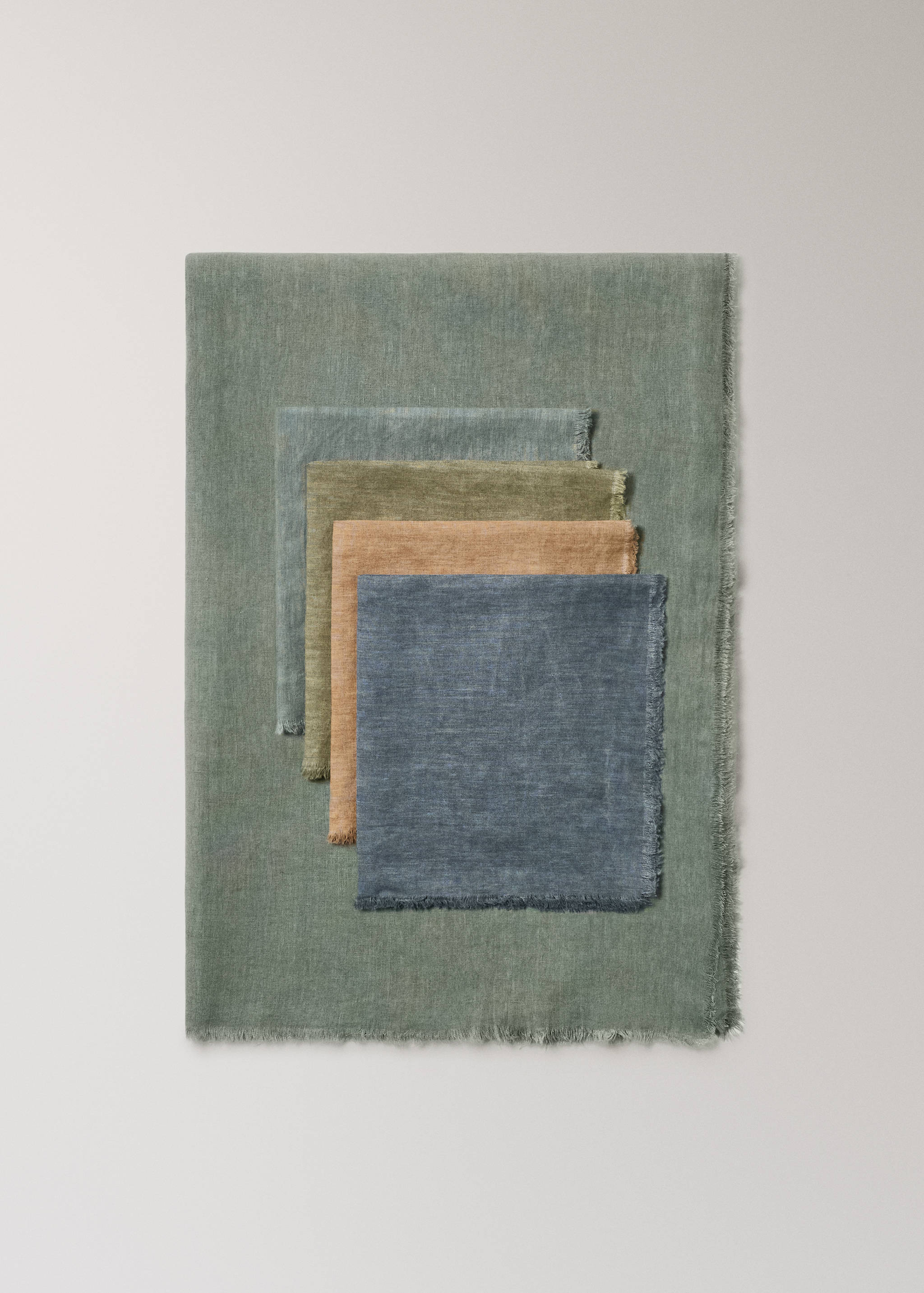 Set of fringed cotton-blend napkins in assorted muted colours.